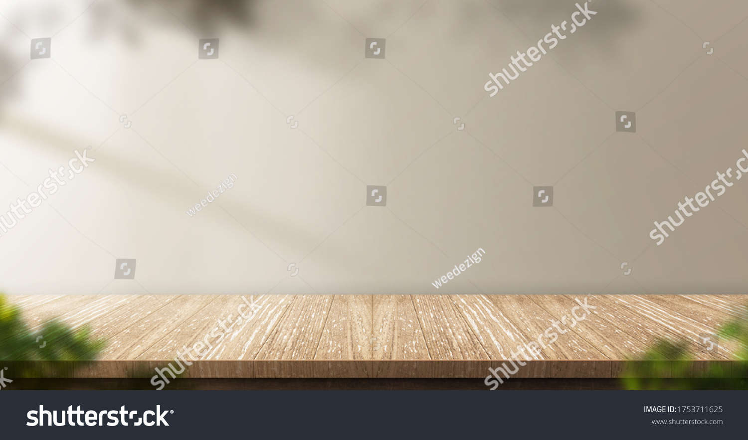 wood table background with sunlight window create leaf shadow on wall with blur indoor green plant foreground.panoramic banner mockup for display of product,warm tone lights #1753711625