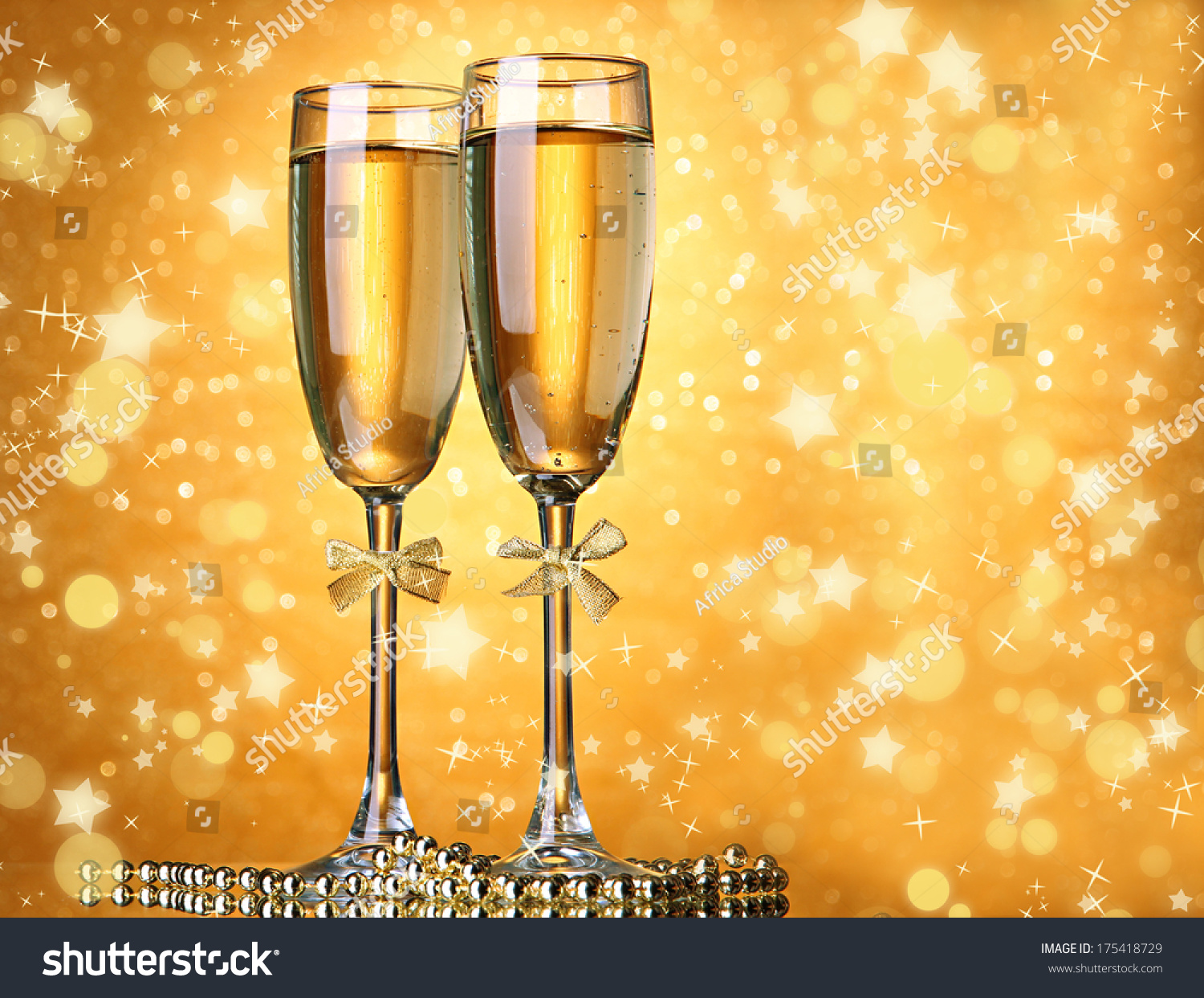 Two glasses of champagne on bright background with lights #175418729
