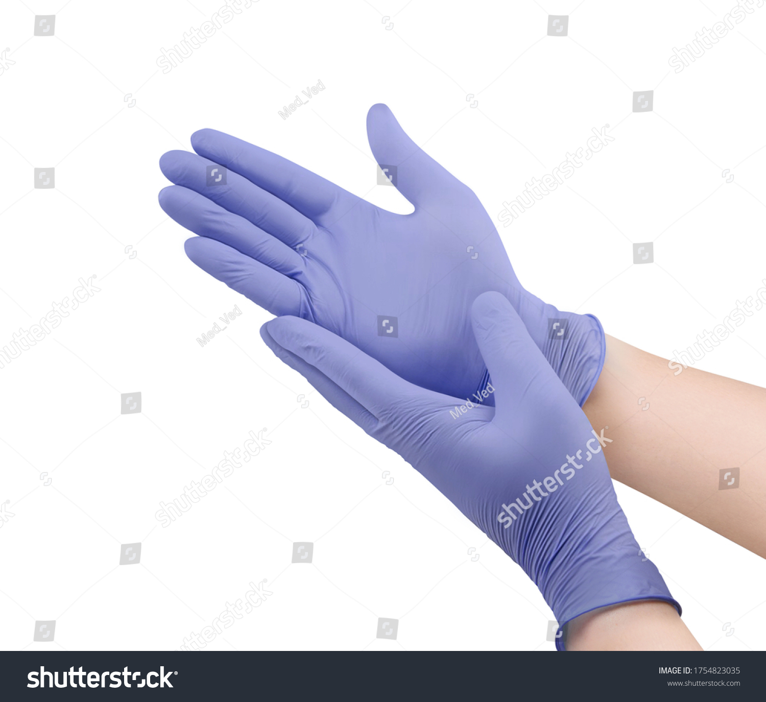 Two purple surgical medical gloves isolated on white background with hands. Rubber glove manufacturing, human hand is wearing a latex glove. Doctor or nurse putting on nitrile protective gloves #1754823035