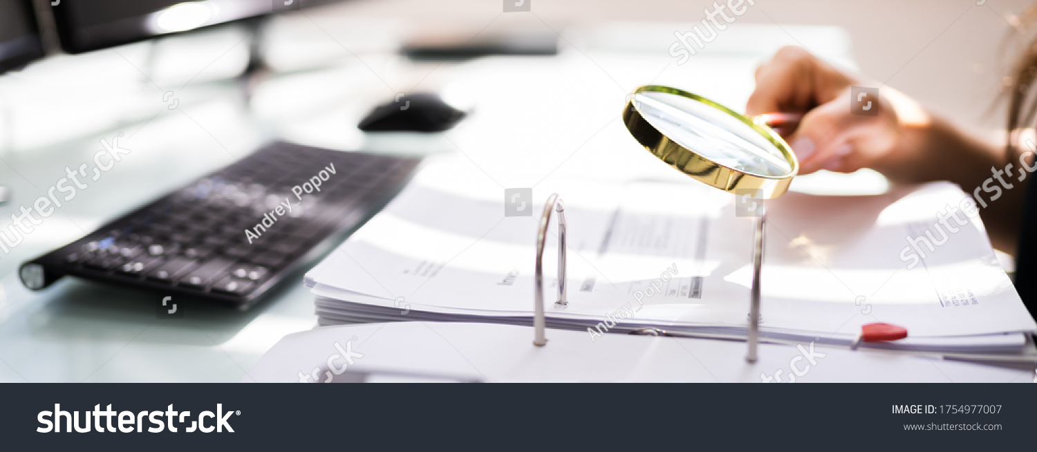 Auditor Investigating Corporate Fraud Using Magnifying Glass #1754977007