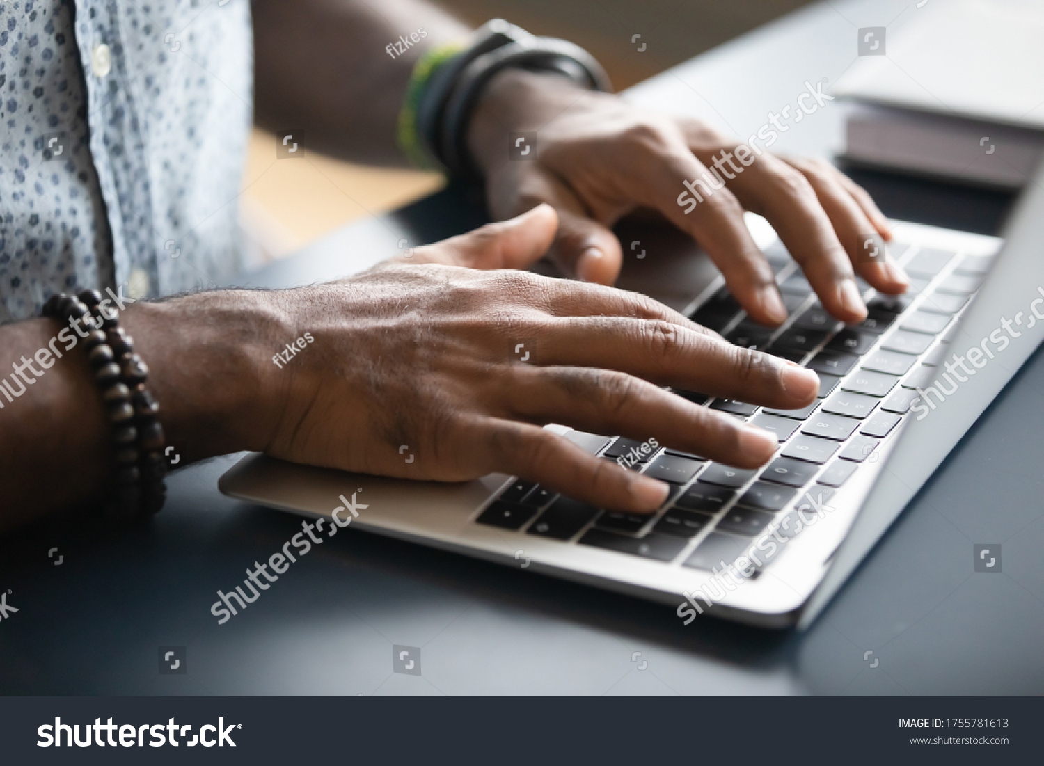 Close up image african male hands typing on laptop keyboard. Businessman answer on client e-mail, customer buying on-line using webshop easy and comfortable services modern wireless tech usage concept #1755781613