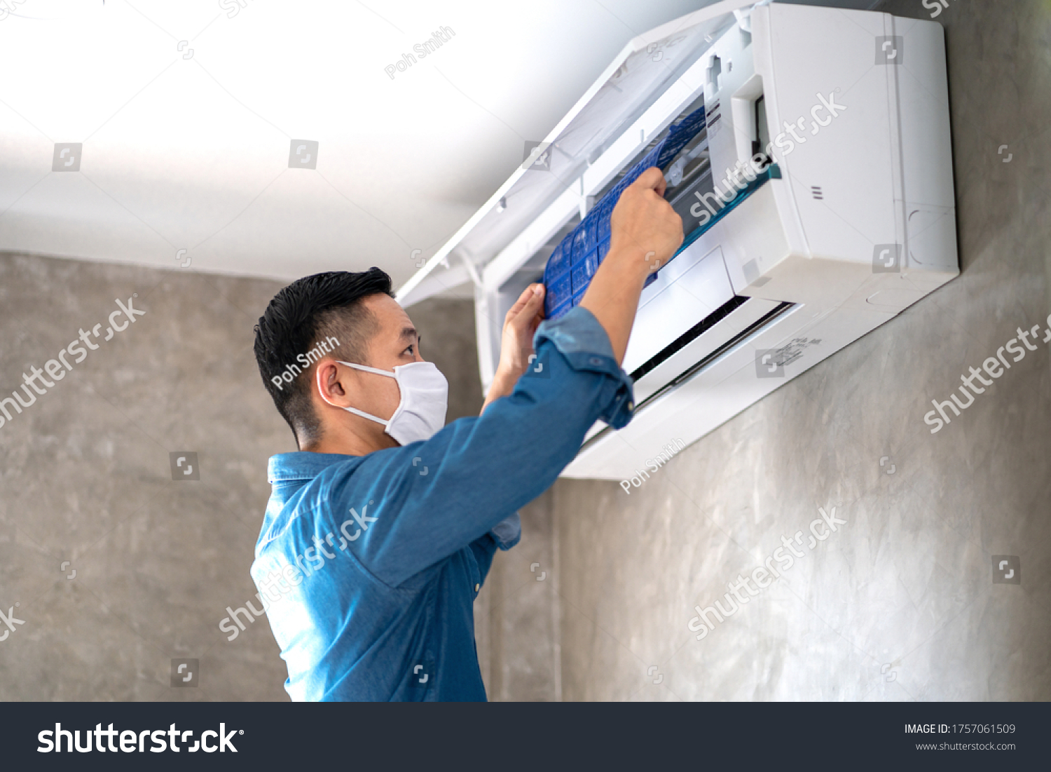 Technician man repairing ,cleaning and maintenance Air conditioner on the wall in bedroom or office room.On site home service,Business ,Industrial concept. #1757061509
