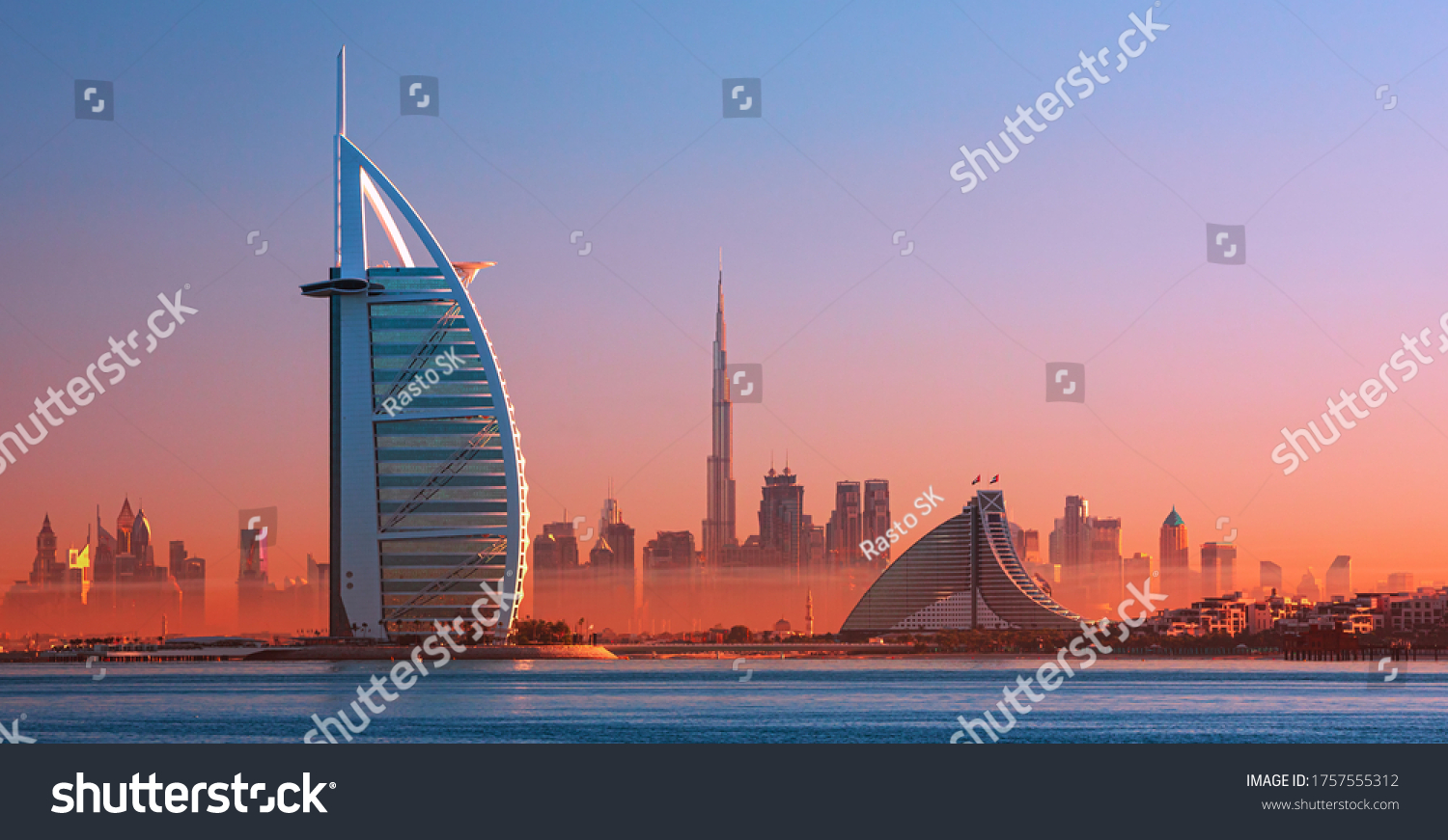 Dubai city - amazing city center skyline and famous Jumeirah beach at sunset, United Arab Emirates #1757555312