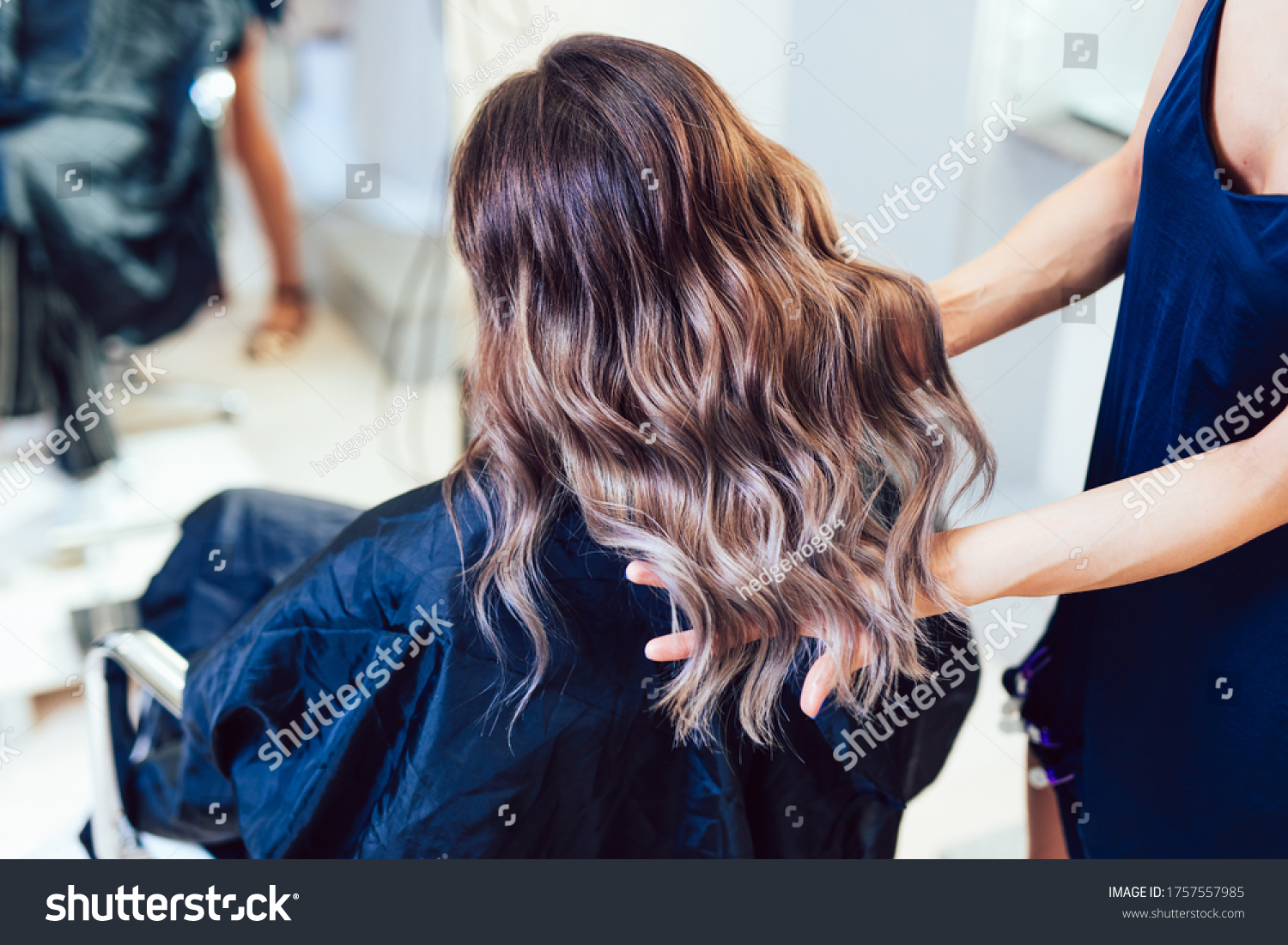 Young woman getting beautiful hairstyle in hair salon. #1757557985