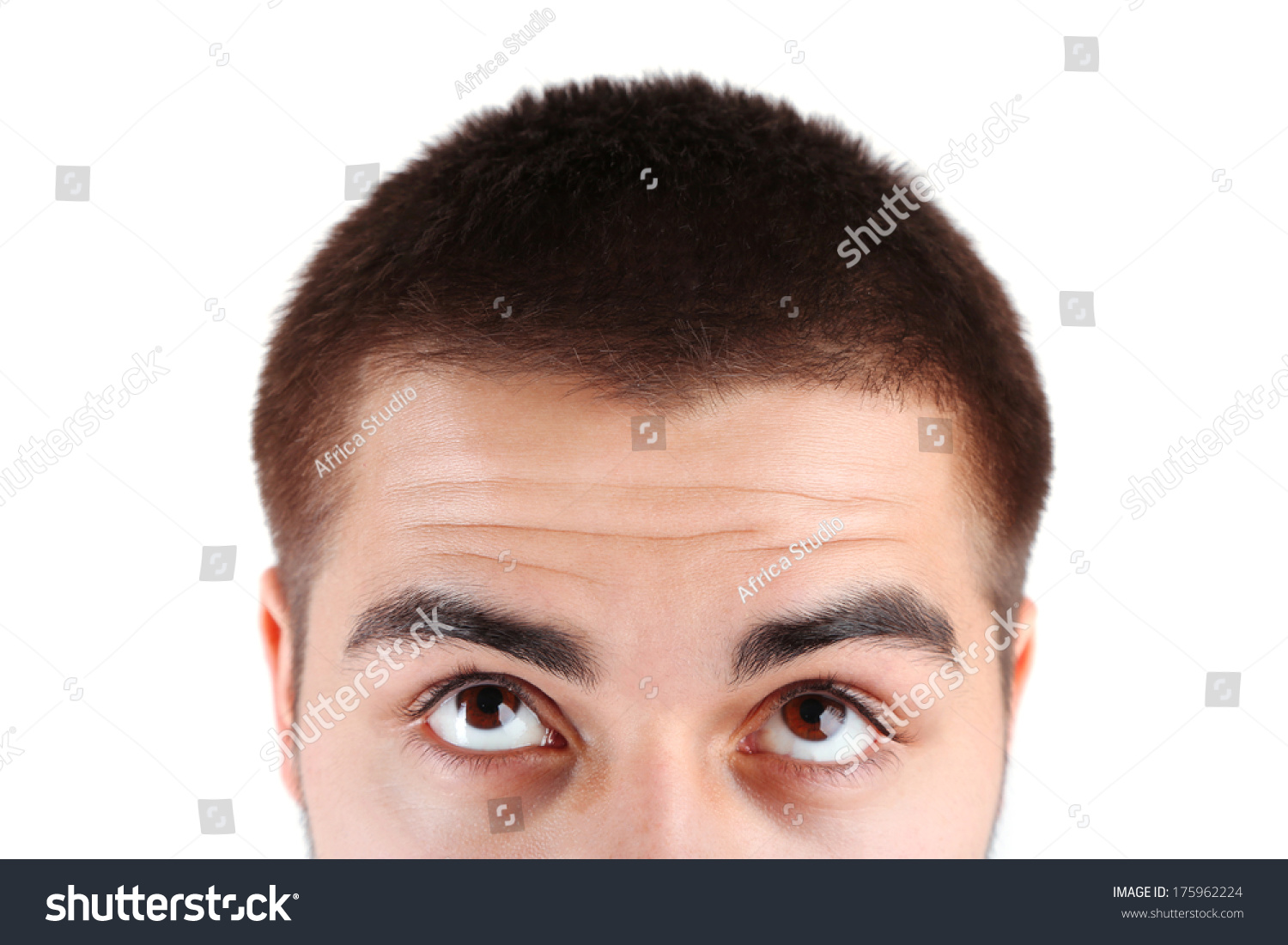Eyes of young man on light background #175962224