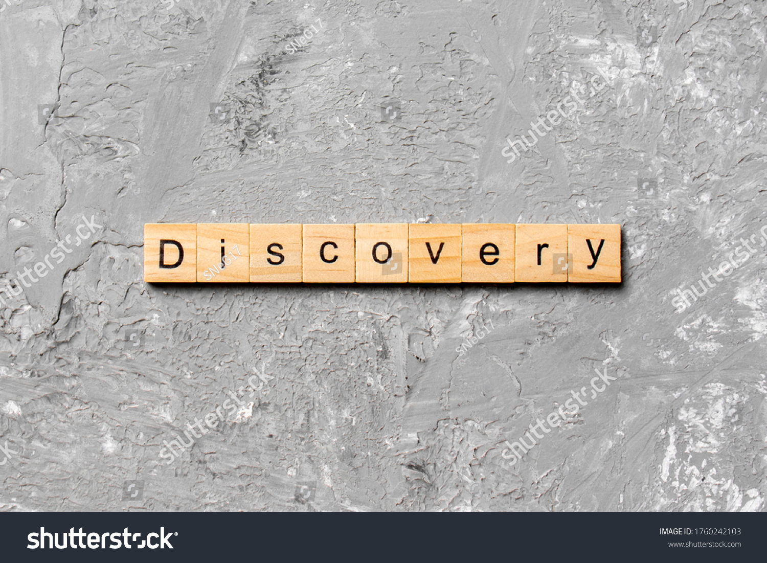 discovery word written on wood block. discovery text on table, concept. #1760242103