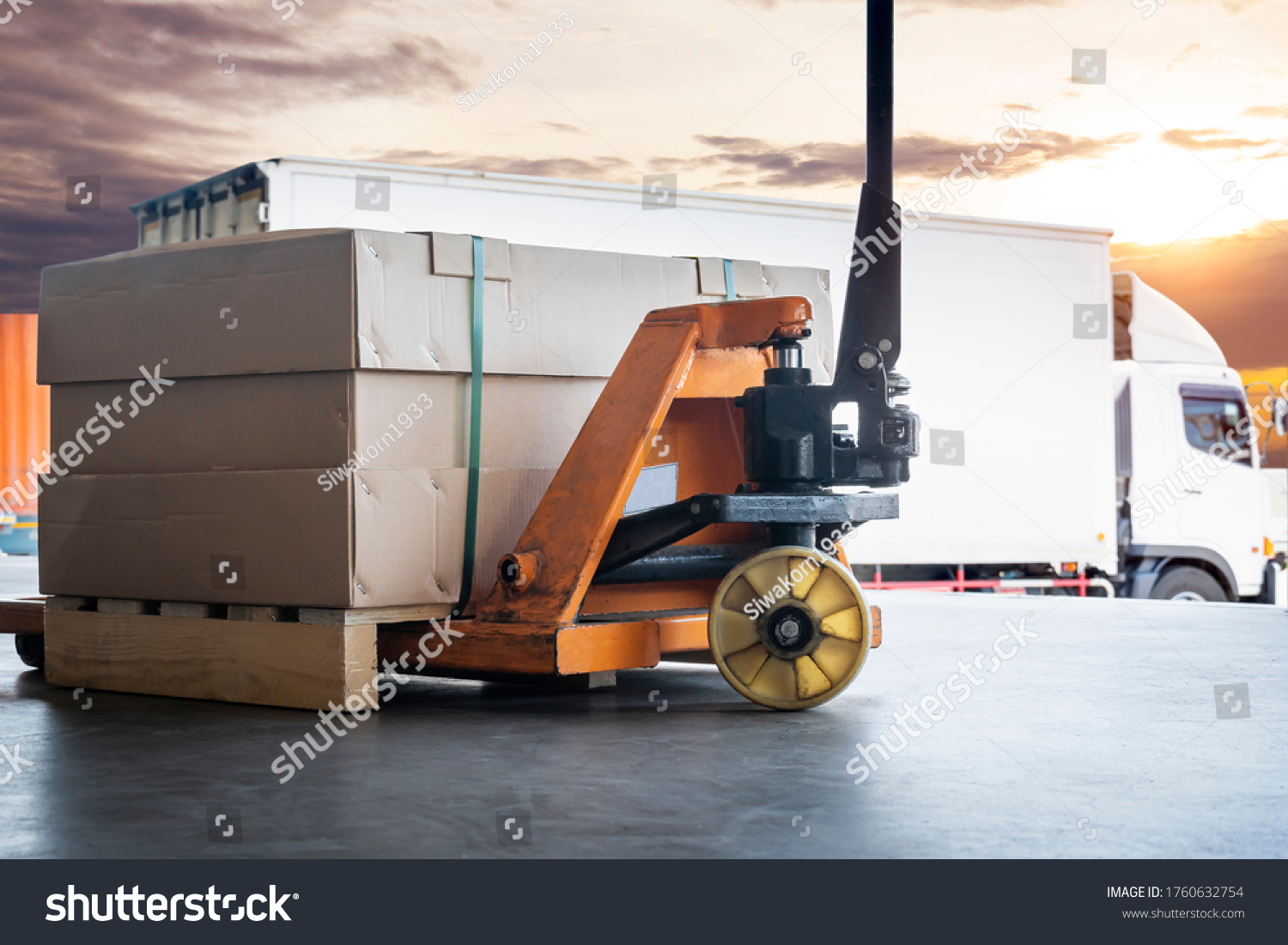 Cargo shipment loading for truck. Large shipments pallet goods with hand pallet truck waiting for load into a truck. Road freight cargo industry. Logistics and transportation. #1760632754