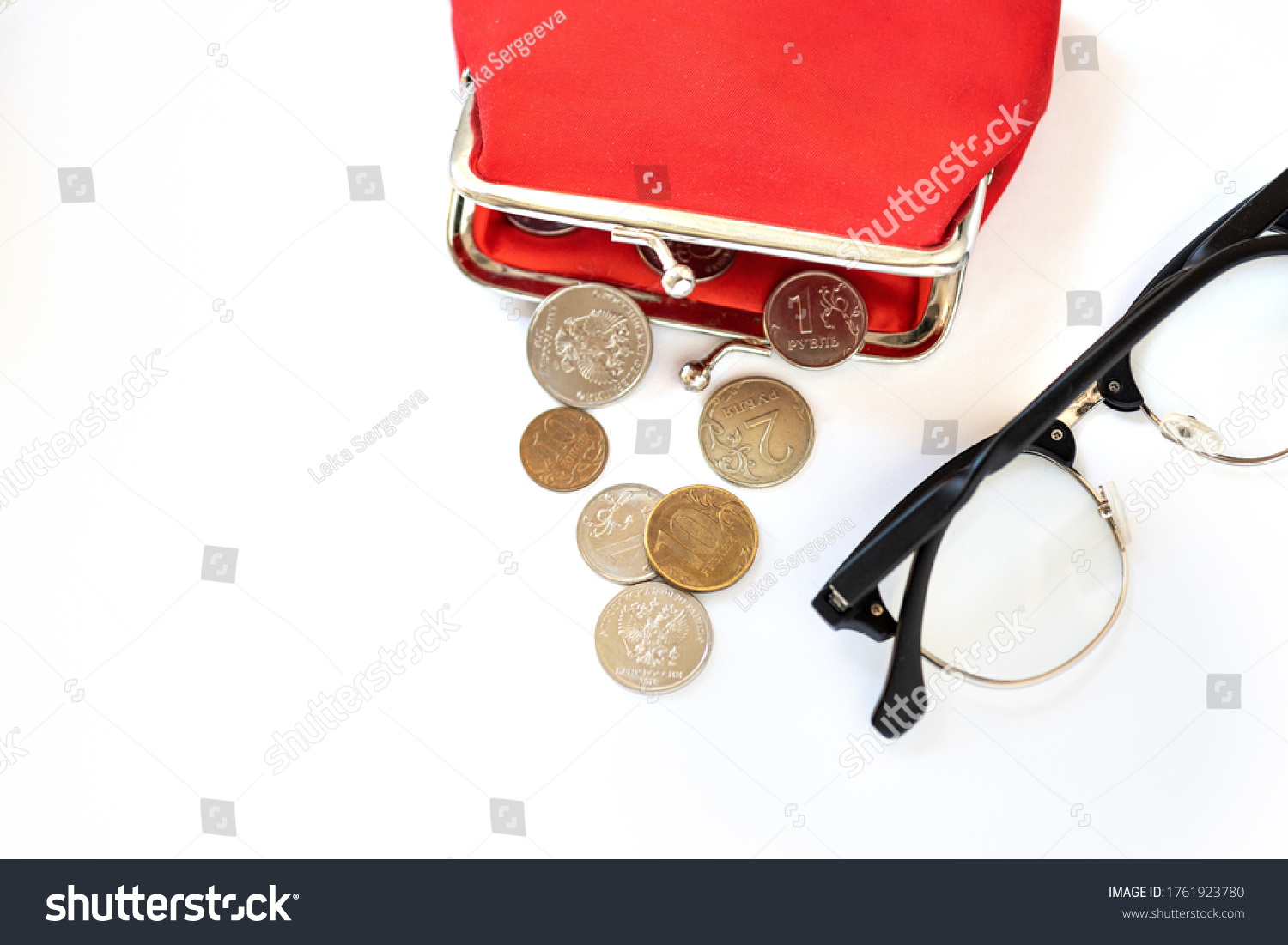 red wallet with Russian coins, rubles and kopecks, the concept of indexing a pension, a living wage, raising the retirement age #1761923780