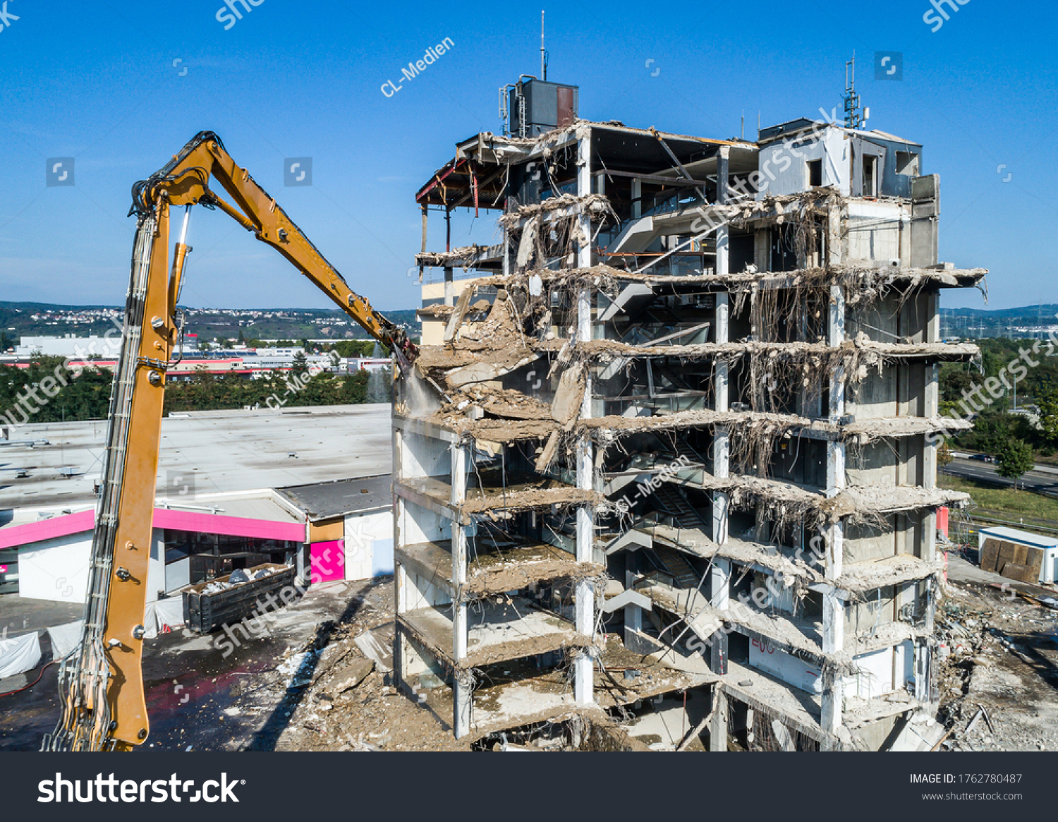 Aerial view of Building House Demolition and construction site Excavator with hydraulic crasher machine #1762780487