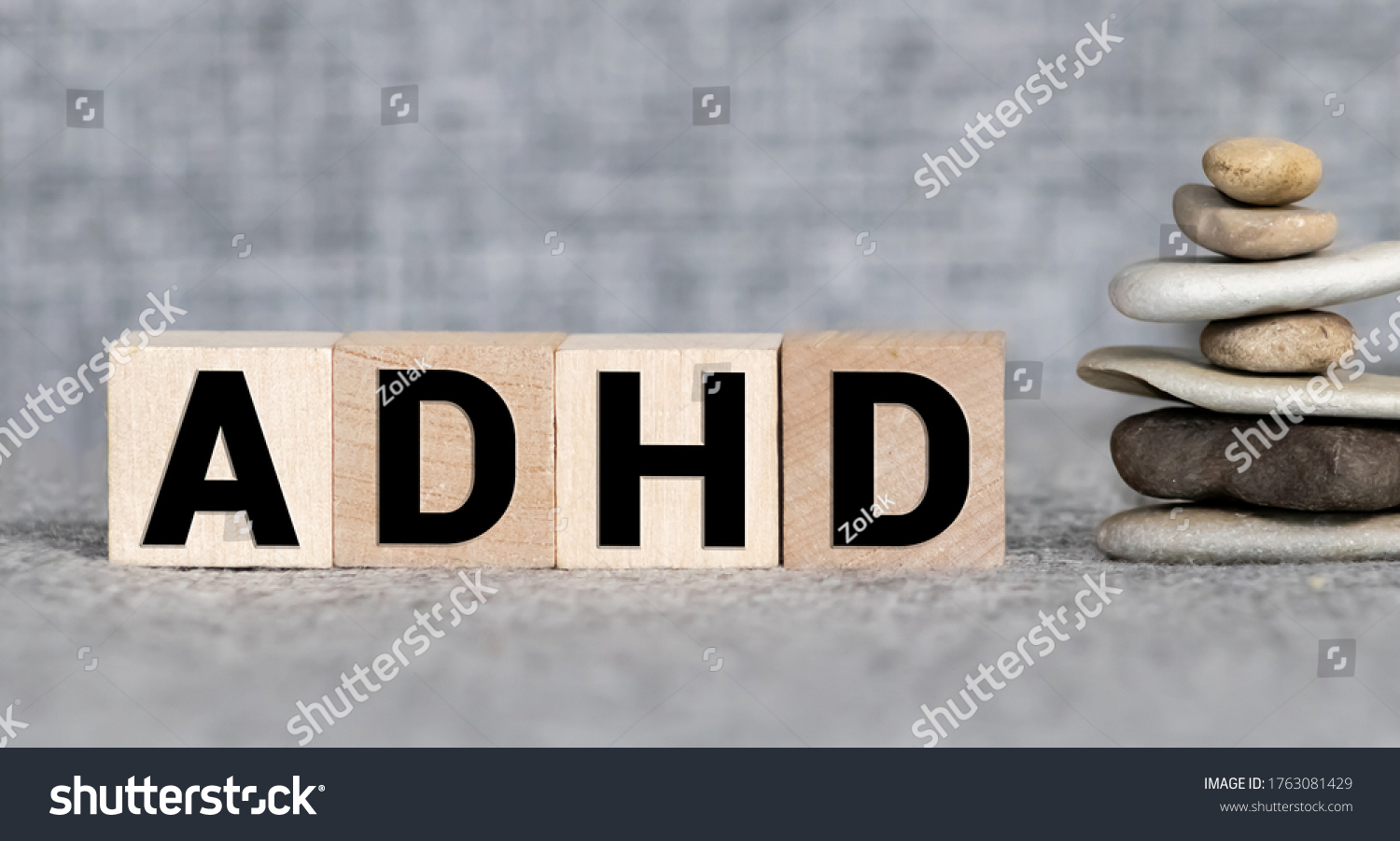 ADHD abbreviation on wooden blocks. ADHD is Attention deficit hyperactivity disorder. Close up. Vignette. #1763081429