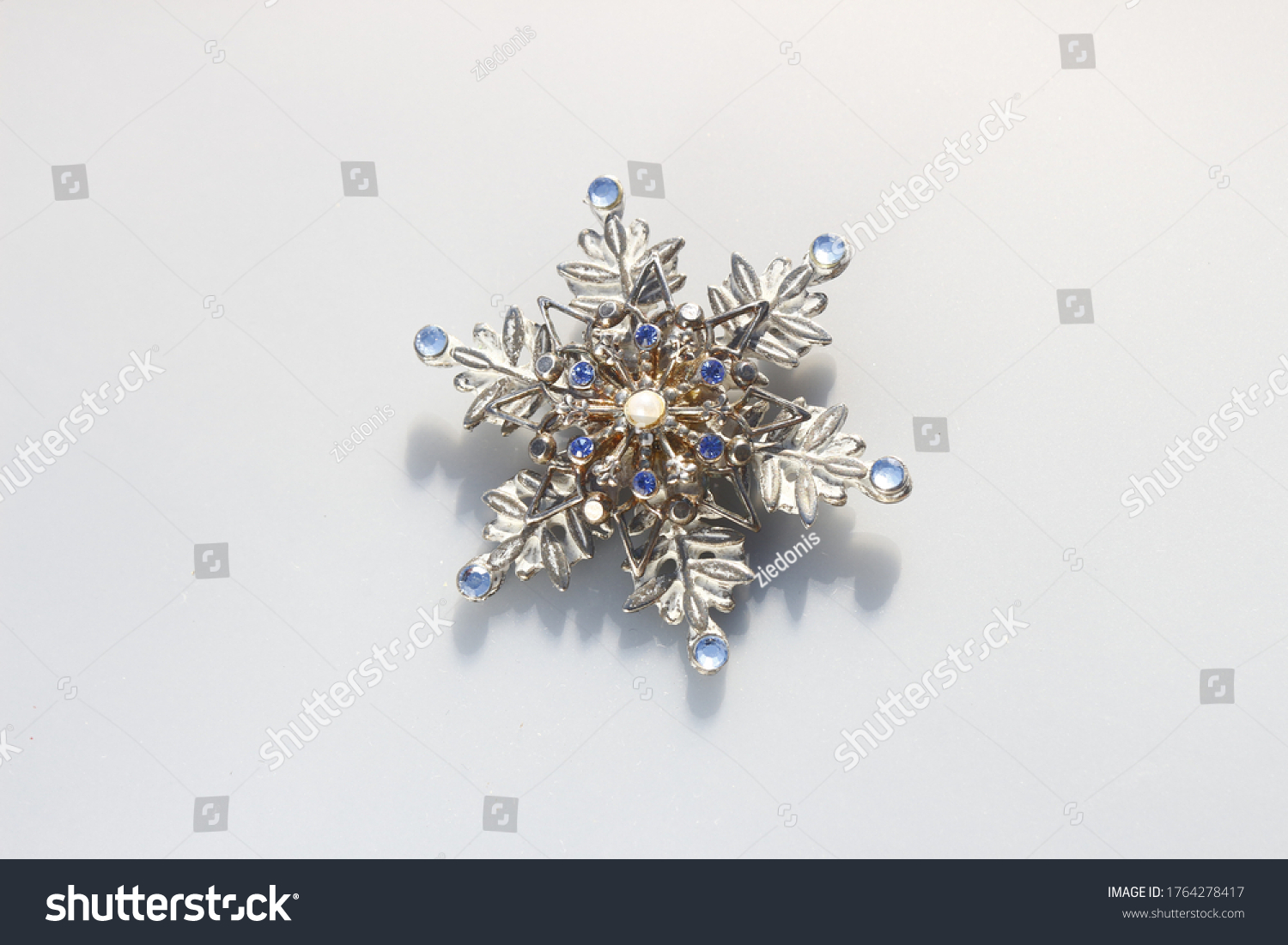 Snowflake silver tone vintage brooch with rhinestones #1764278417