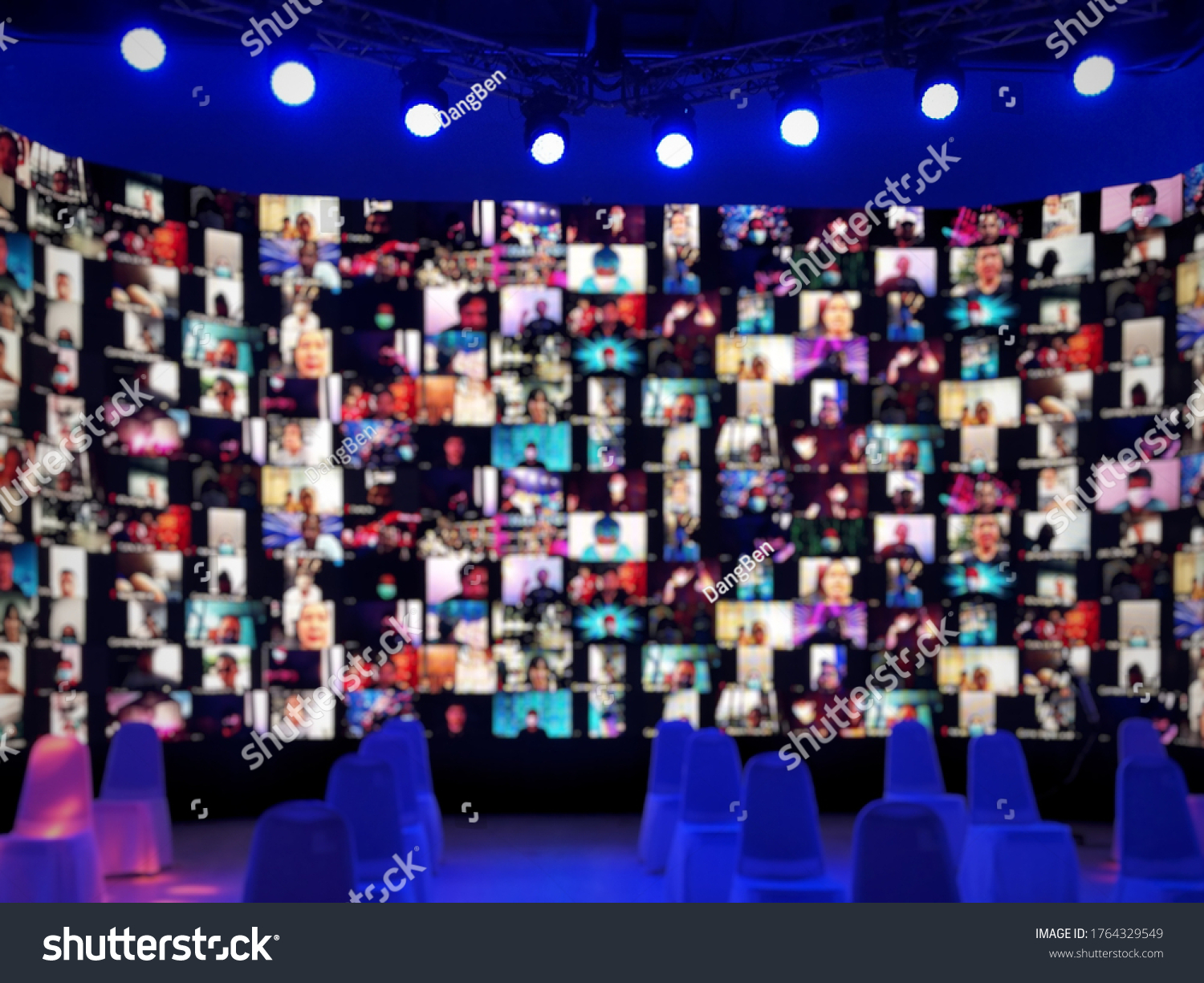 Blur large LED screen show many people's faces join big online event or virtual reality live conference. Video conference, Work from home, Social distancing, New normal event production.  #1764329549
