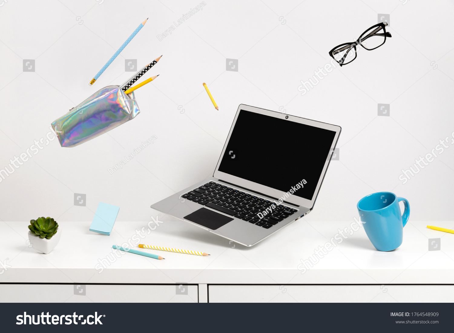 Office supplies stationery levitate over white table. Back to school work education creative layout #1764548909
