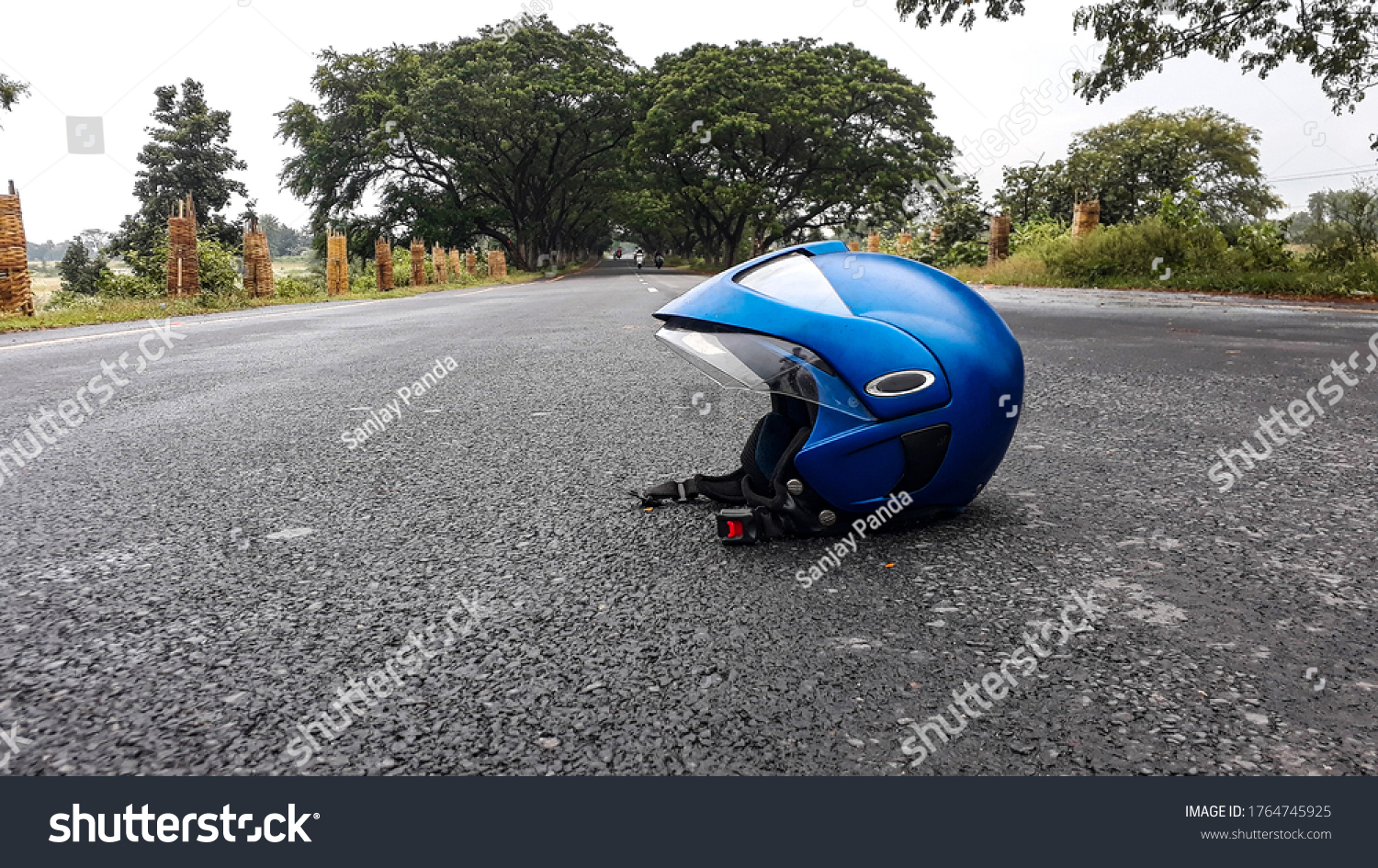 helmet on the middle of road #1764745925