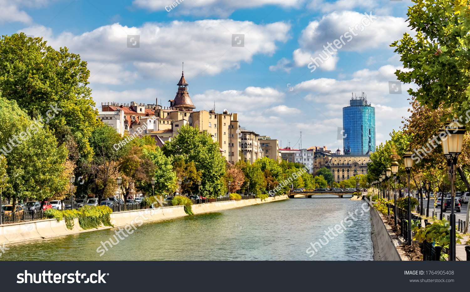 Cityscape view across Dambovita river city of Bucharest in autumn season in Romania #1764905408