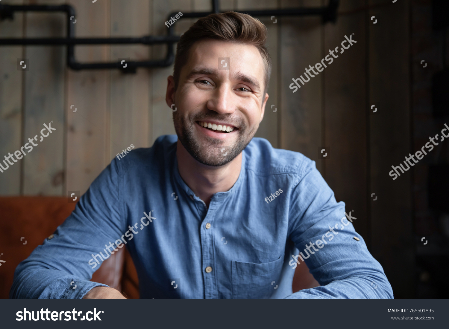 Head shot portrait smiling Caucasian man sitting indoors having pleasant web cam videoconference on-line chat by work or informal speak use pc. Job interview, tutoring video call, modern tech concept #1765501895