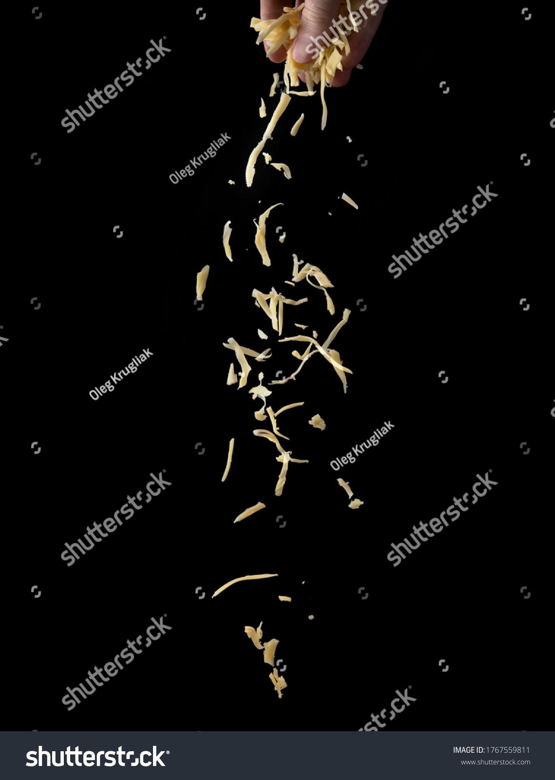 Shredded cheese on a black background #1767559811