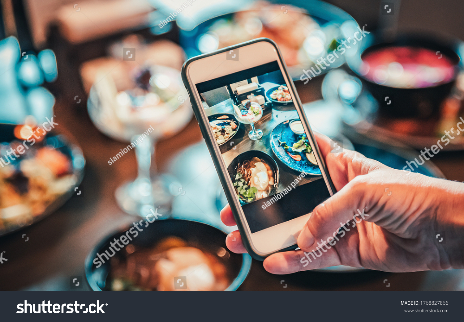 woman hand with smartphone photographing food at restaurant or cafe #1768827866