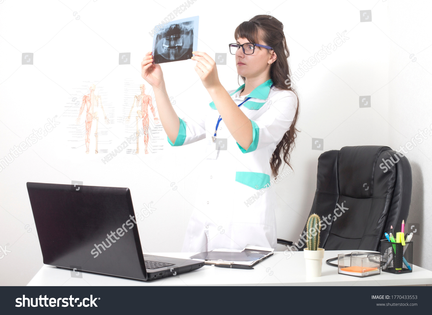 Dentist doctor watching x-ray picture orthopantomogram of jaw and teeth. Dentures, caries and pulpitis of wisdom teeth, background #1770433553