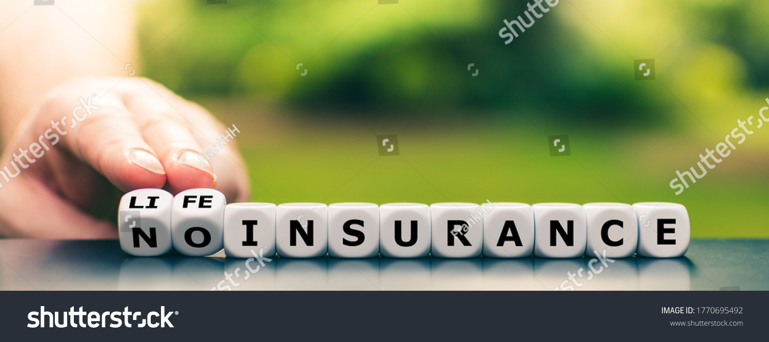 Hand turns dice and changes the expression "no insurance" to "life insurance". #1770695492
