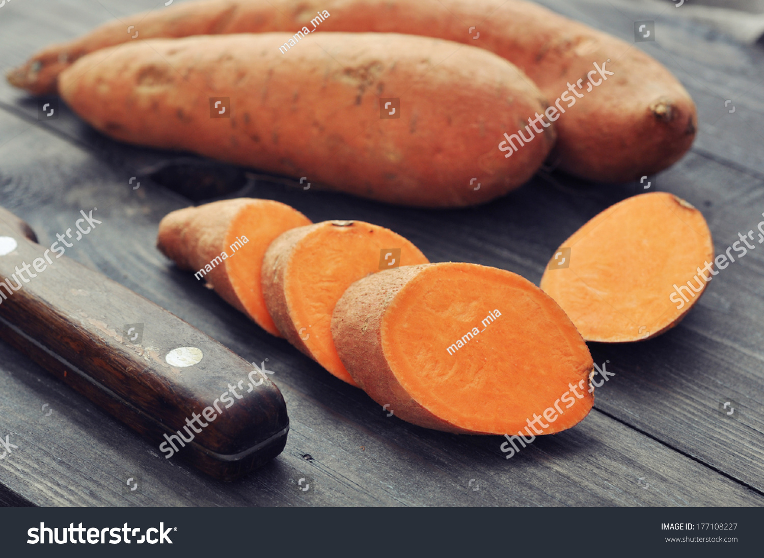 Raw sweet potatoes on wooden background closeup #177108227