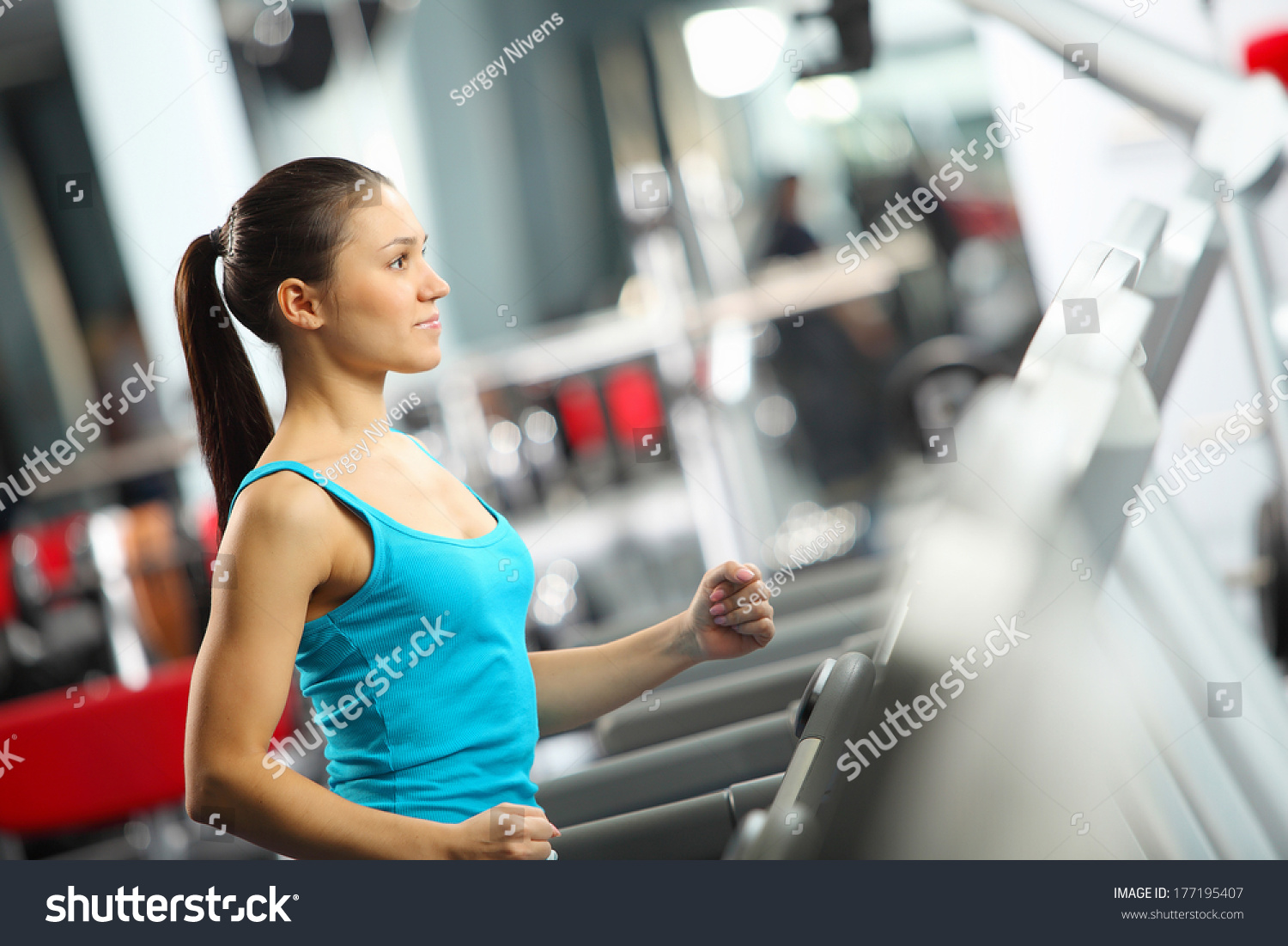 Image of fitness girl running on treadmill #177195407