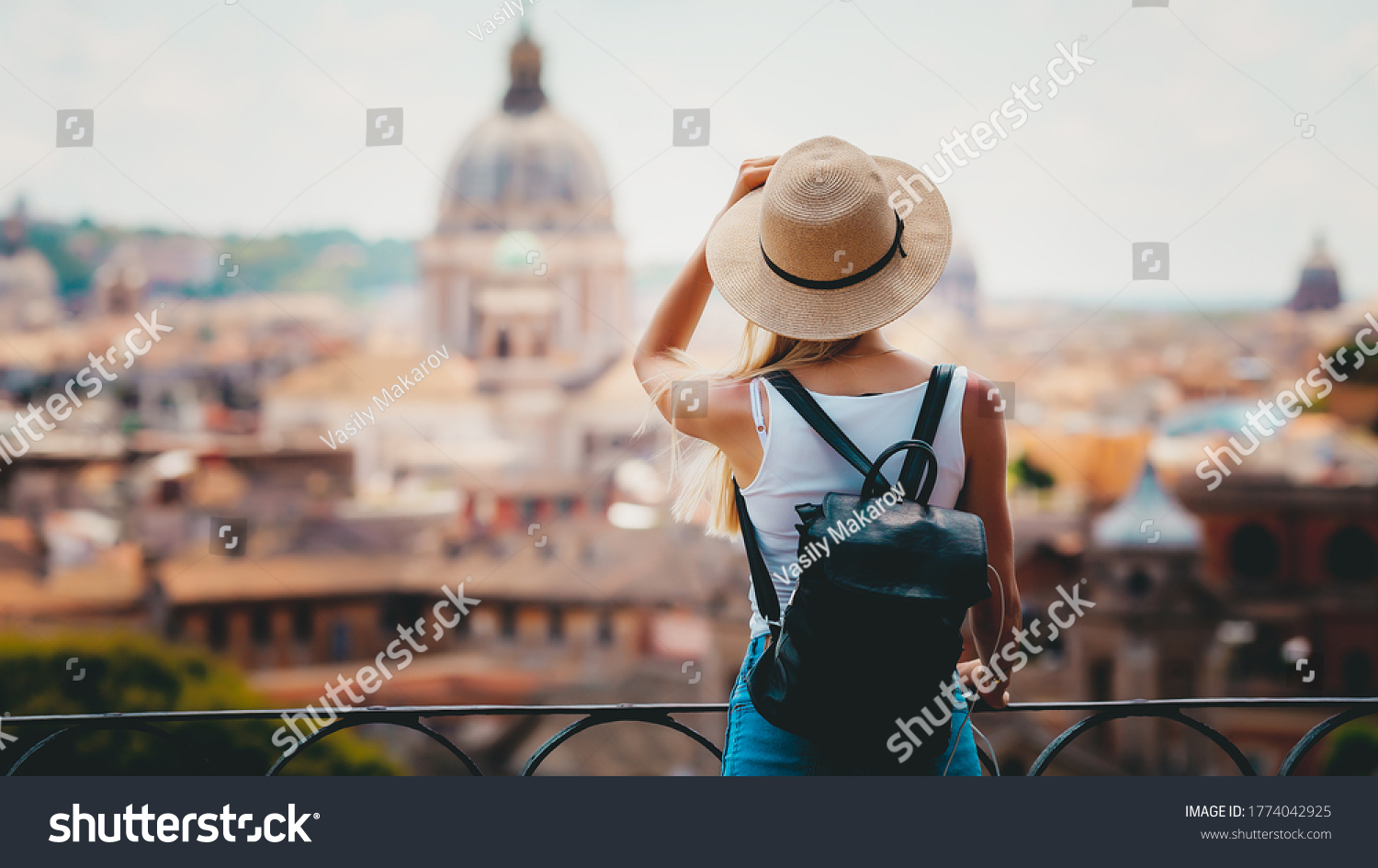 Rome Europe Italia travel summer tourism holiday vacation background -young smiling girl with mobile phone camera and map in hand standing on the hill looking on the cathedral Vatican #1774042925