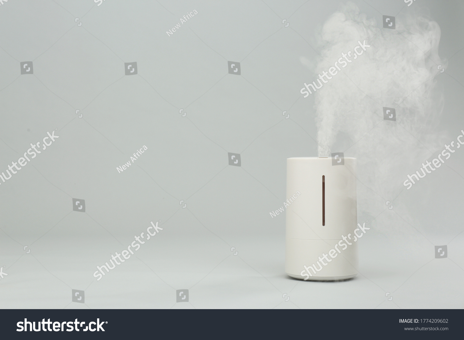 Modern air humidifier on light grey background. Space for text #1774209602