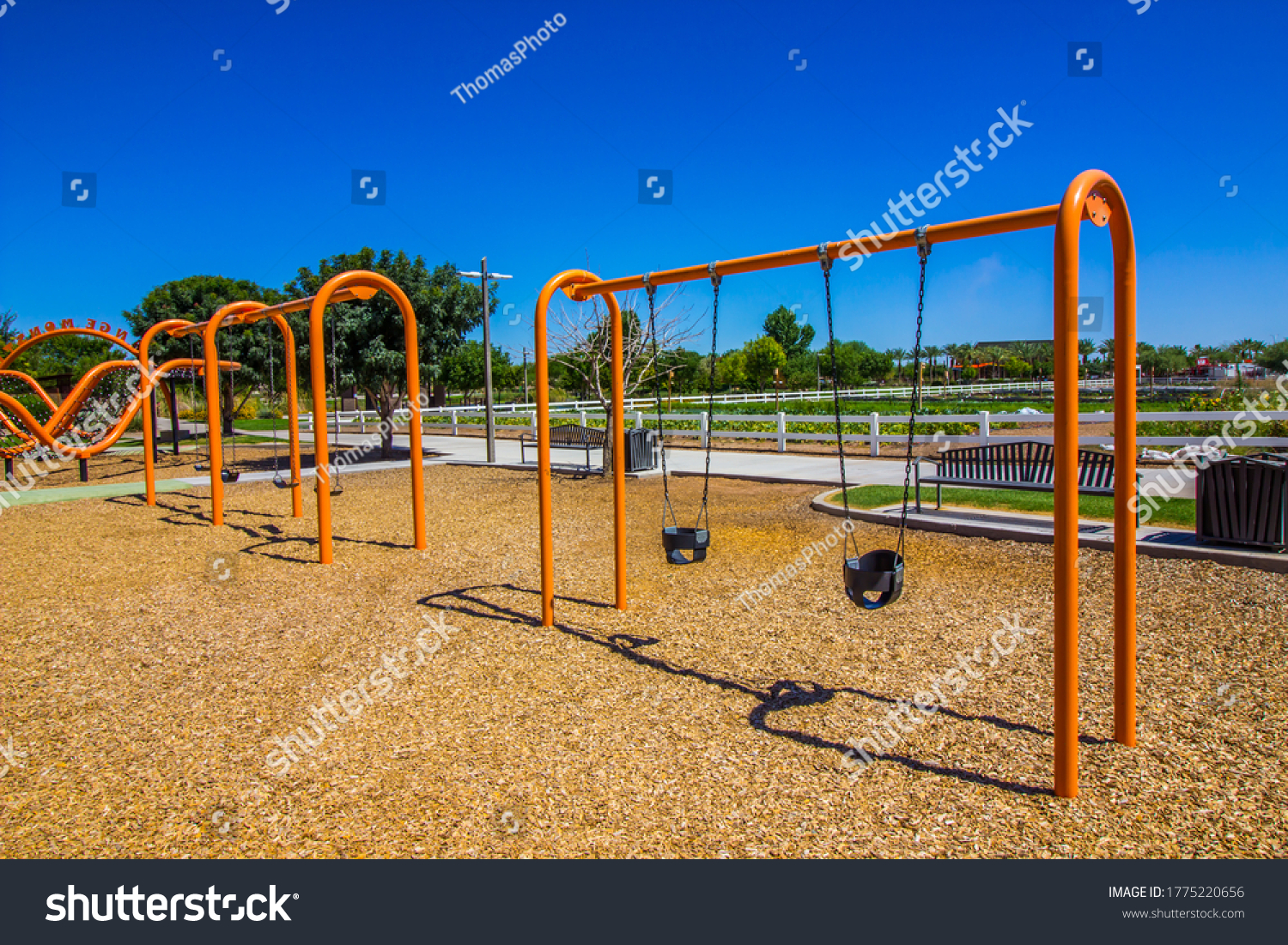 Bright Orange Swing Sets At Public Park #1775220656
