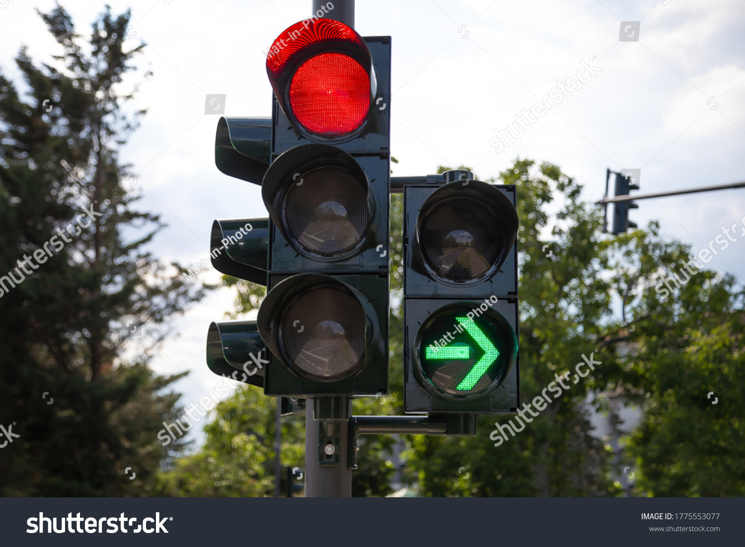 red german traffic light with green arrow light up allow by law to turn right #1775553077