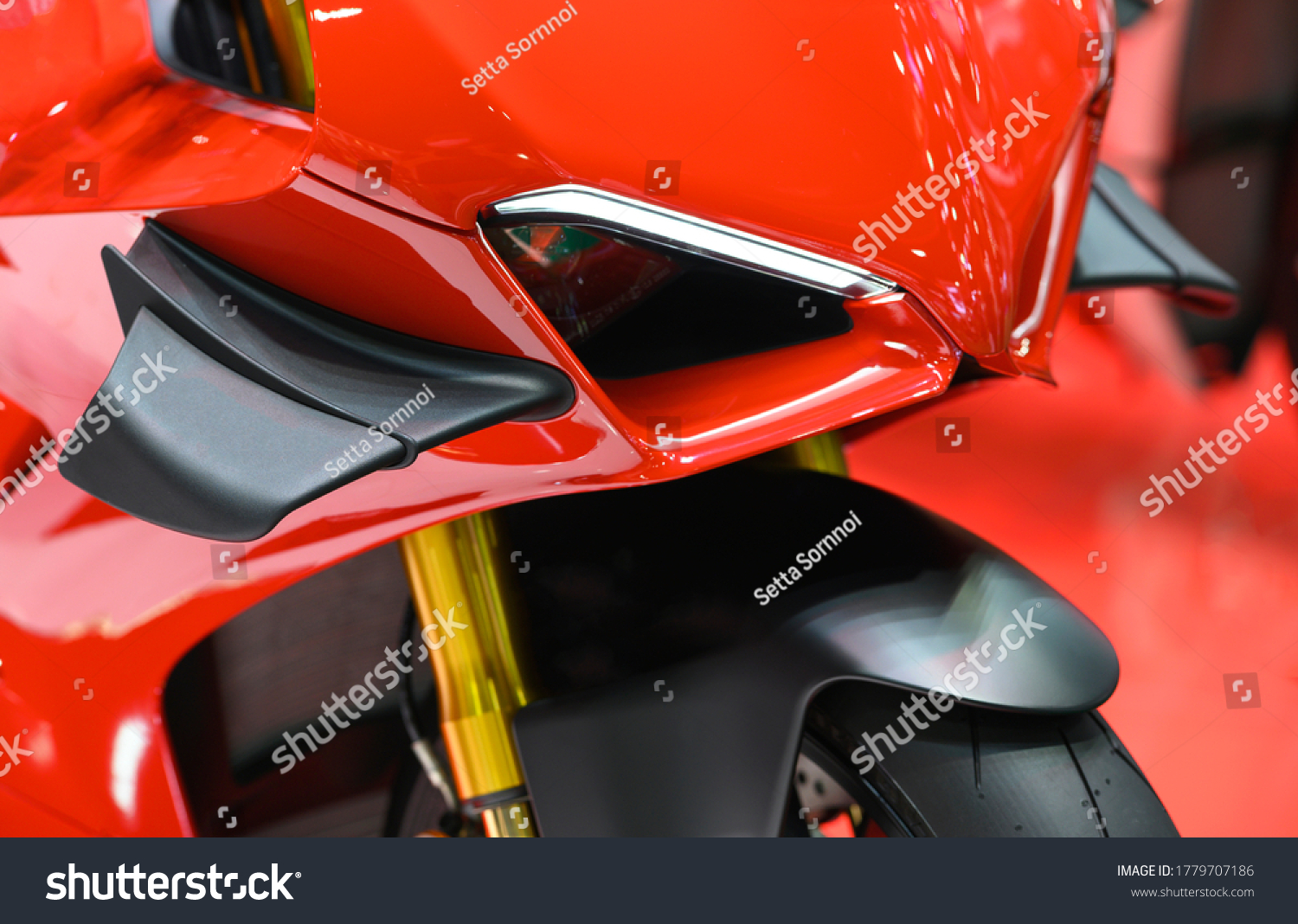 Close-up of front winglet air deflector on motorbike. #1779707186