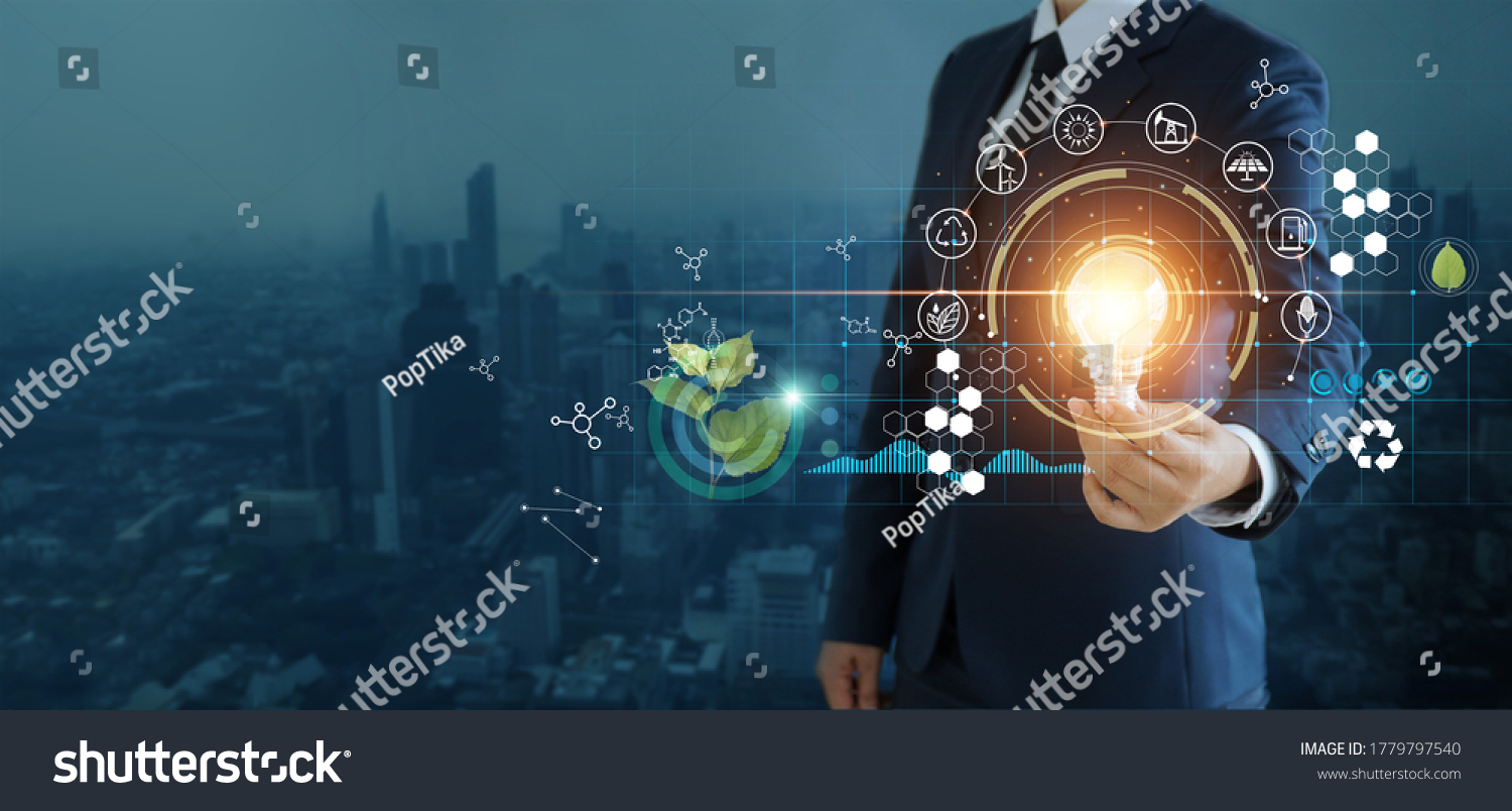 businessman holding light bulb against nature on city background  with icons energy sources for renewable, sustainable development,  Ecology and renewable energy concept. #1779797540