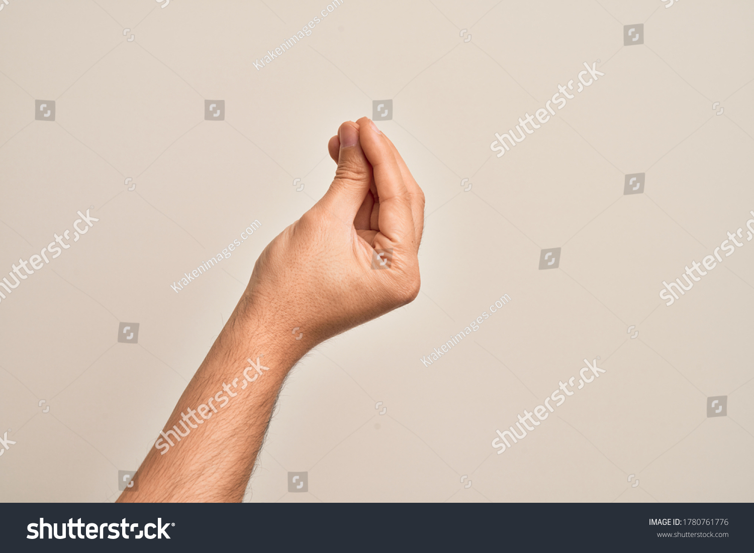 Hand of caucasian young man showing fingers over isolated white background doing Italian gesture with fingers together, communication gesture movement #1780761776