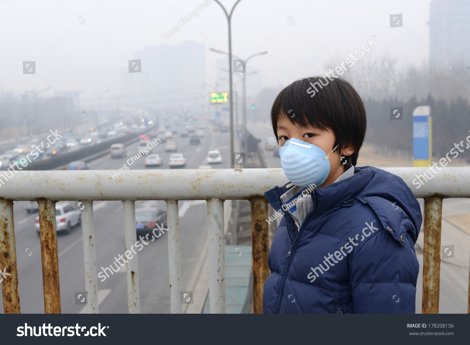 Asian boy wearing mouth mask against air pollution (Beijing) #178208156