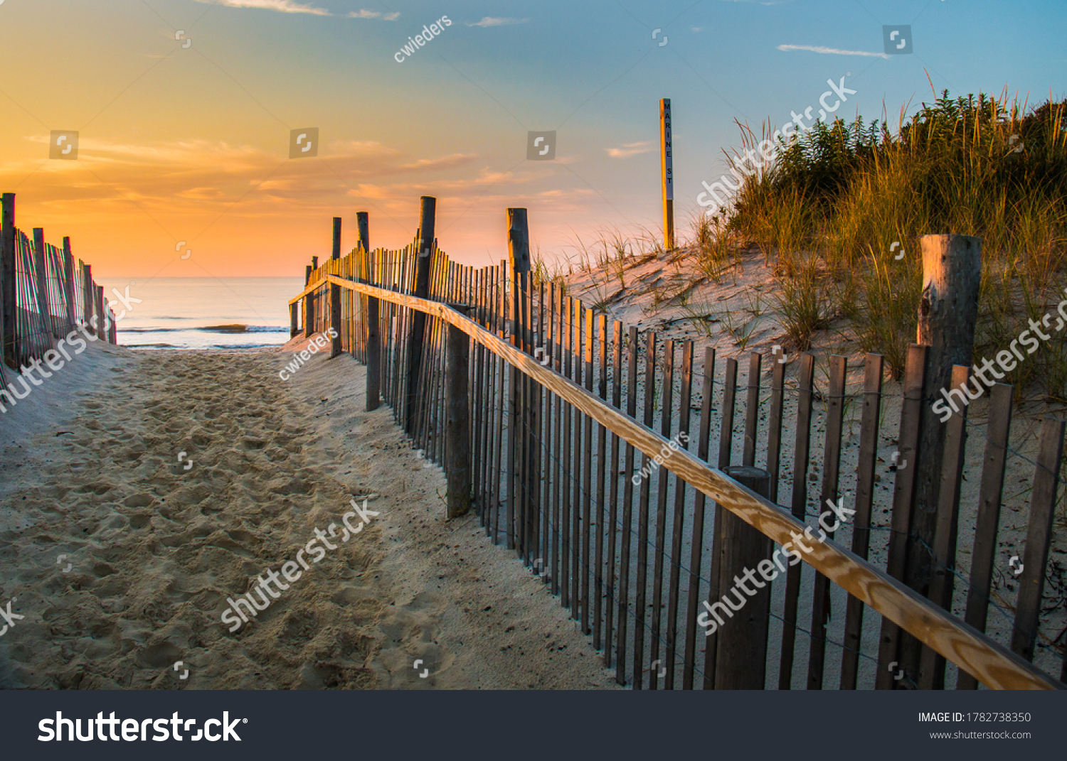 Sunrise glows at the Atlantic seashore at Marine St. in Beach Haven, New Jersey #1782738350
