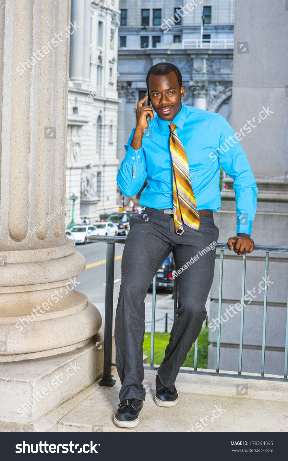 light blue shirt and gray pants