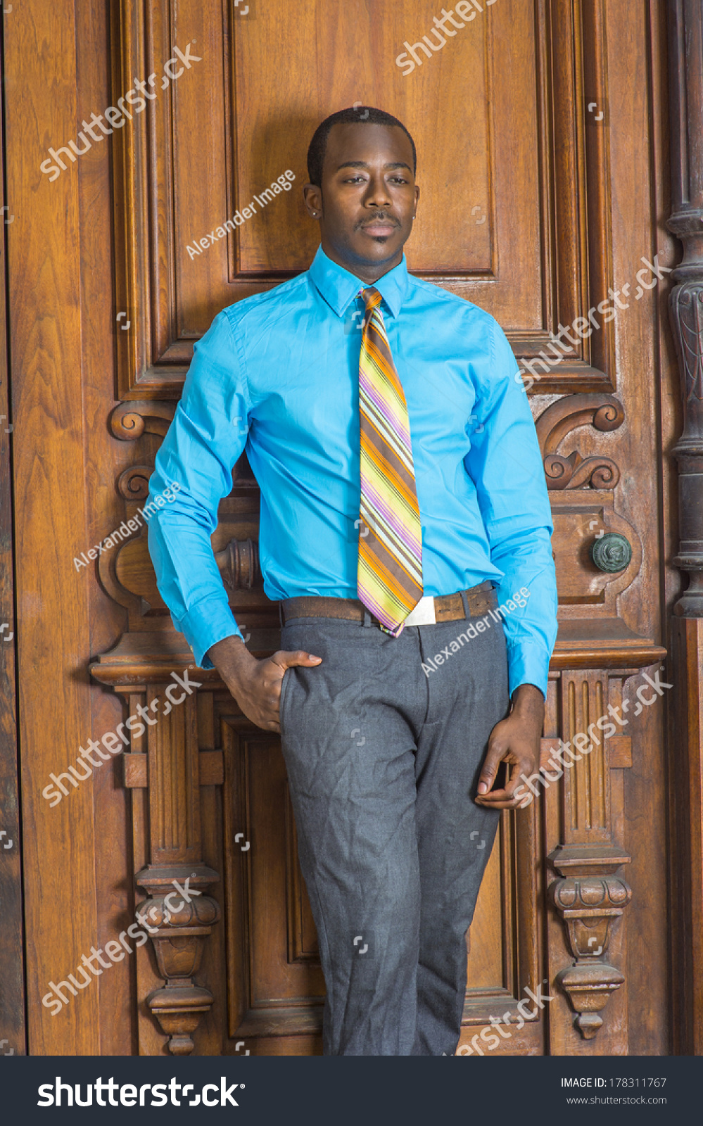 blue shirt, gray pants 