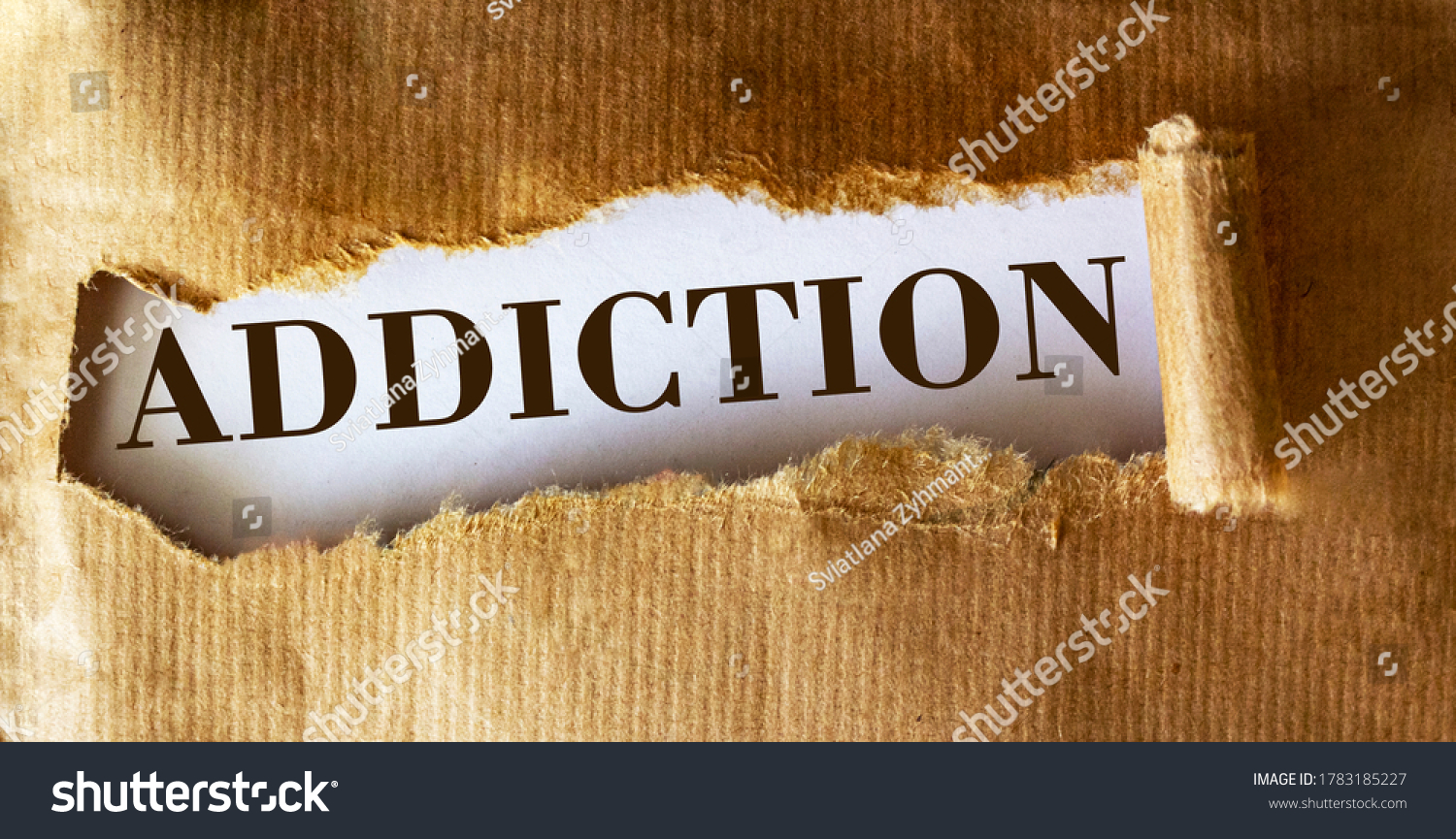 The word Addiction is written underneath brown torn paper. #1783185227
