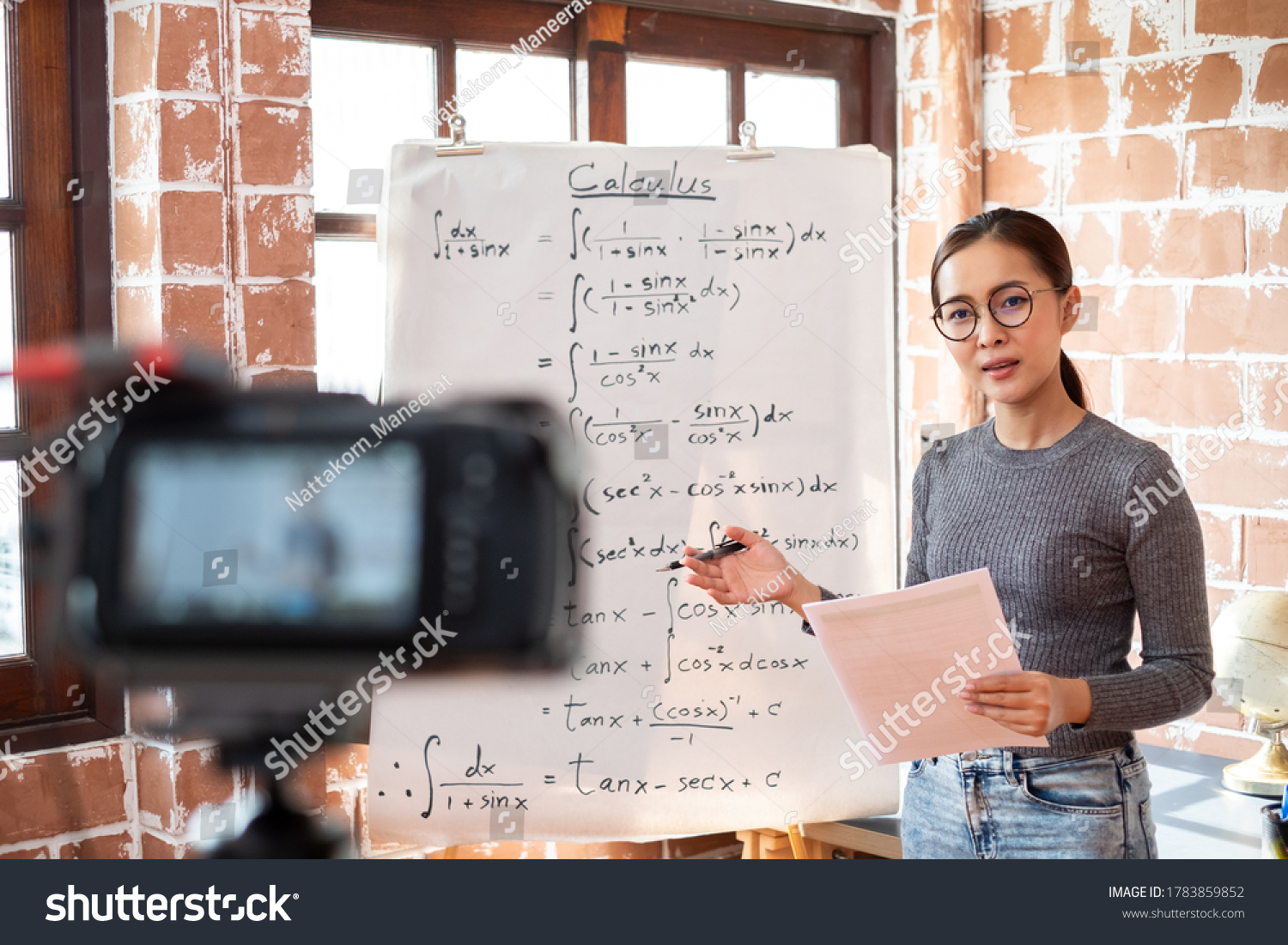 Asian woman teacher teaching online lesson via internet at home, self study and e-learning new normal concept #1783859852