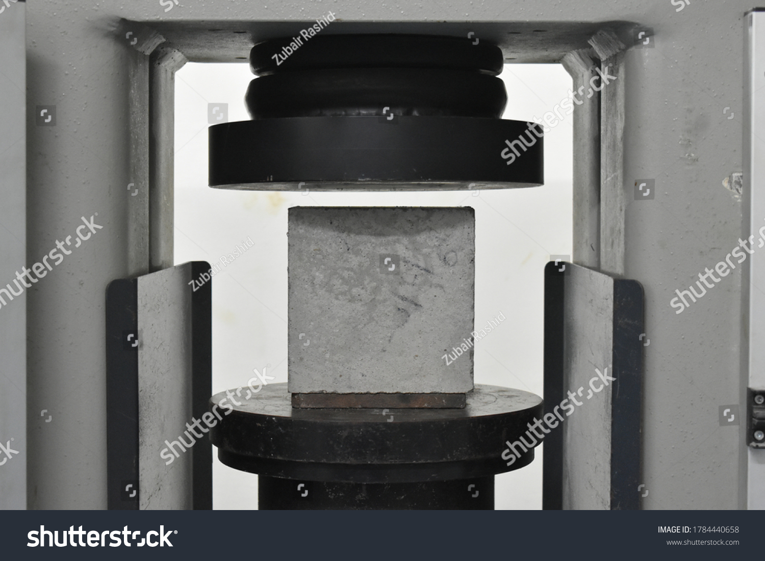concrete cube tested in a UTM #1784440658