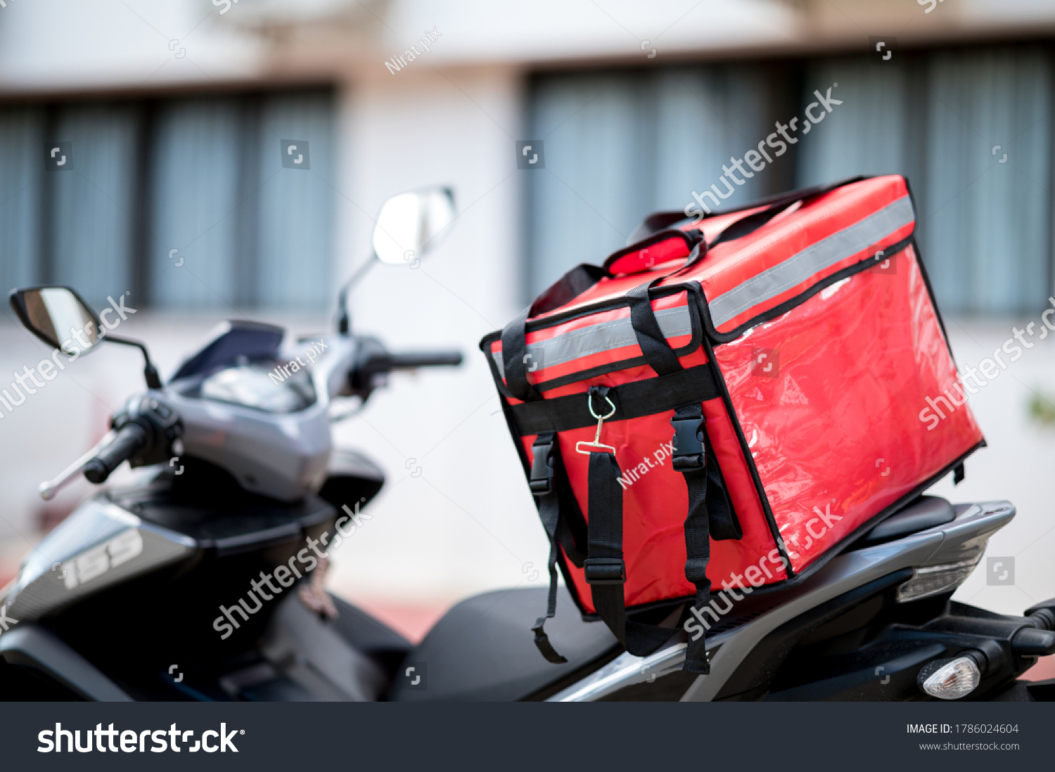 delivery box placed on the motorcycle for delivery to customers #1786024604