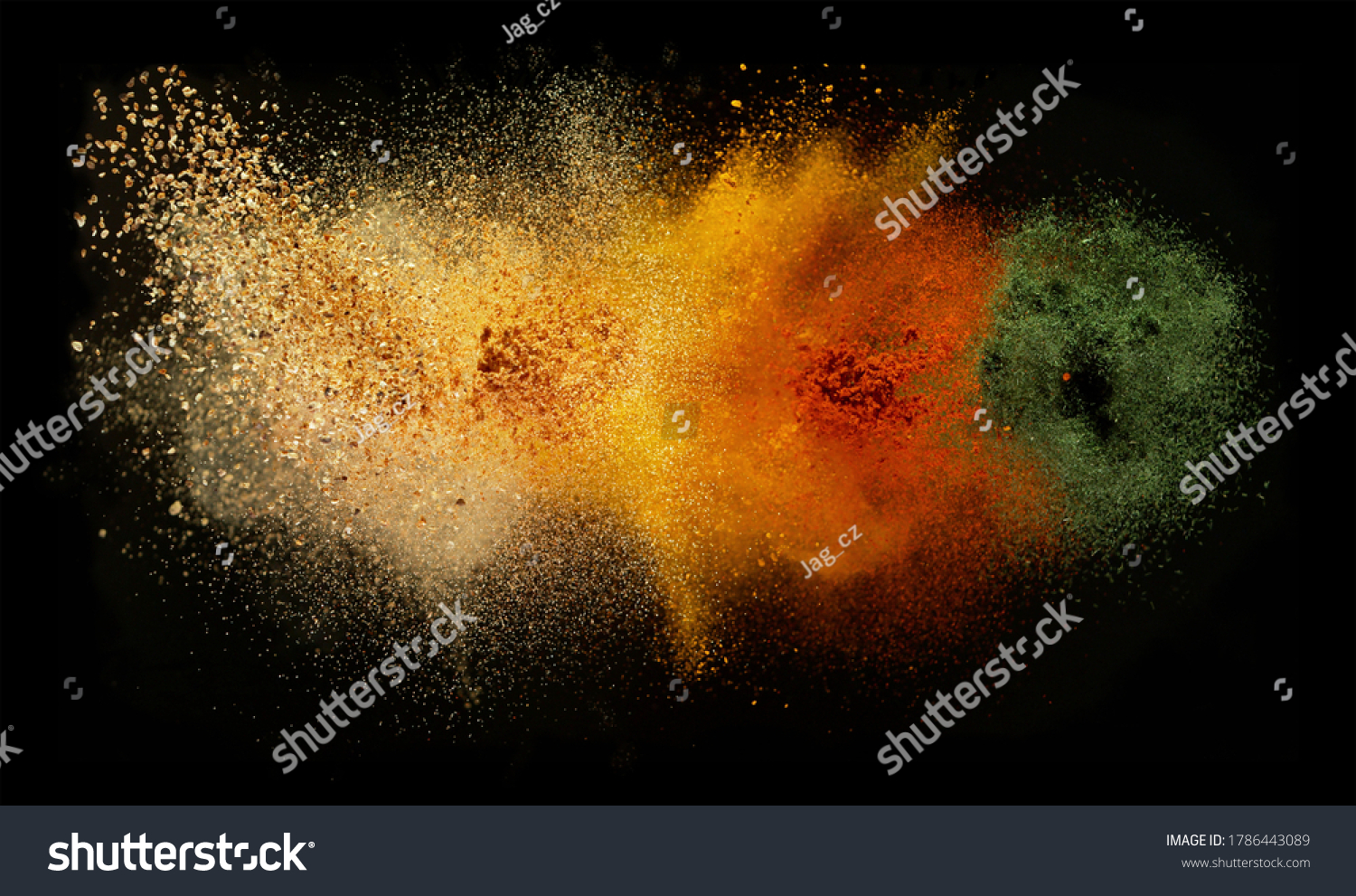 Freeze motion of various spice explosion, abstract culinary background. Isolated on black background #1786443089