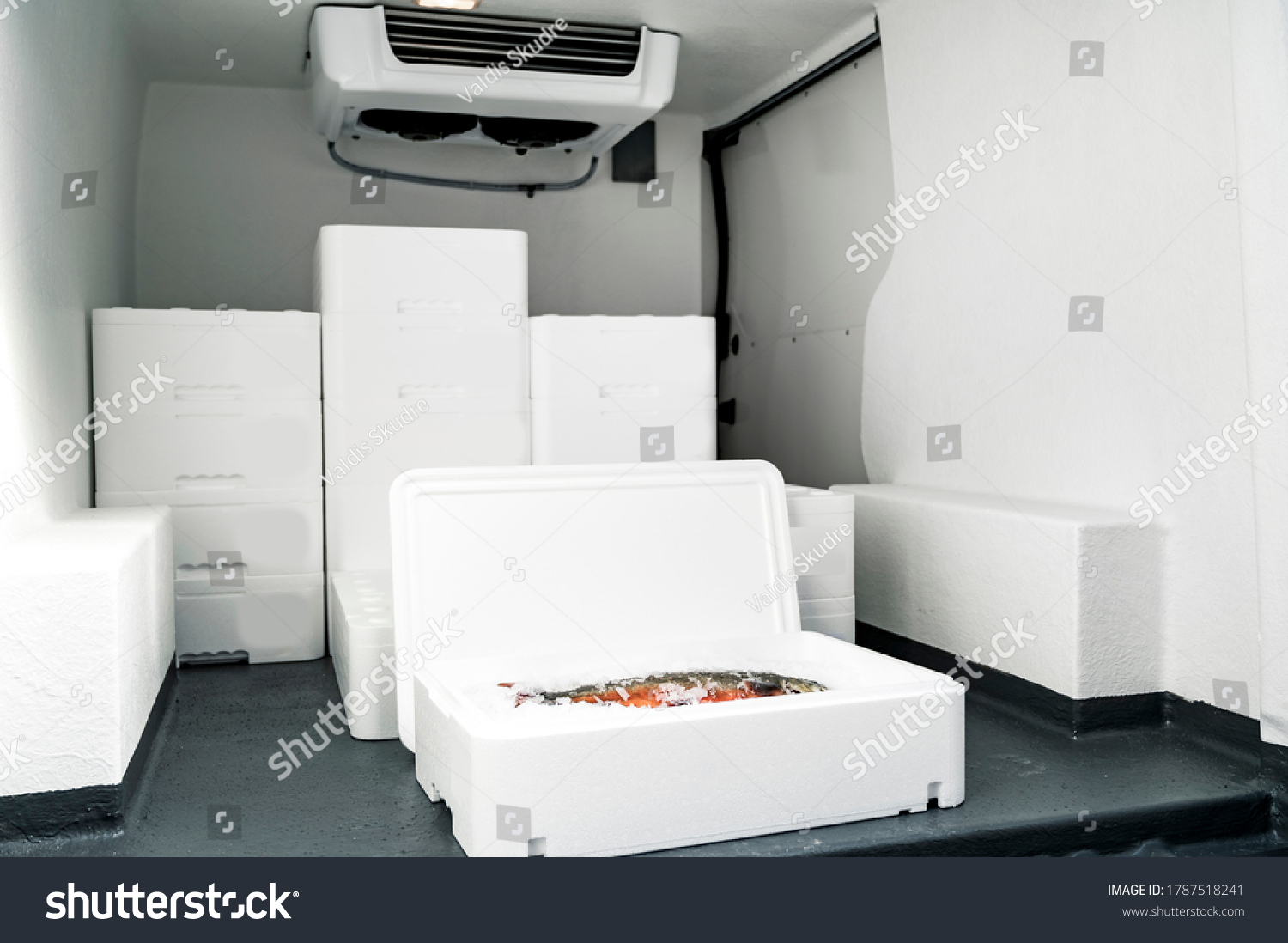 White boxes with ice and fish loaded in van for transportation #1787518241