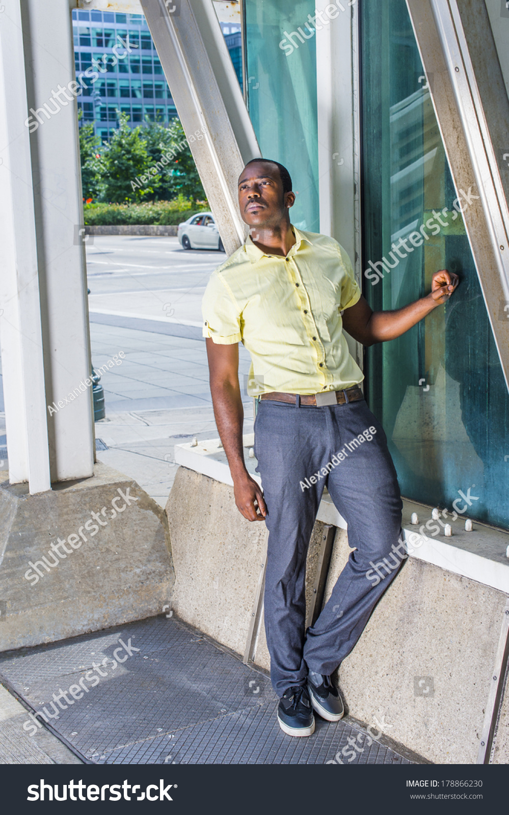 yellow shirt gray pants