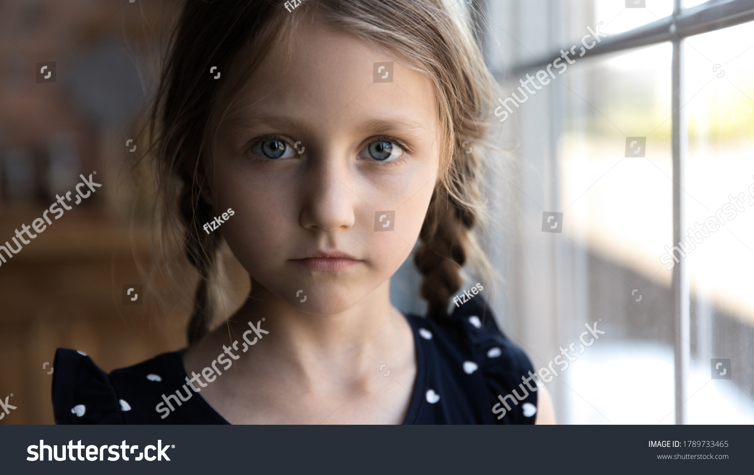 Crop close up portrait of serious sad little Caucasian girl look at camera, unhappy small child kid orphan feel lonely abandoned, outcast or loner miss parents, children drama, volunteer concept #1789733465