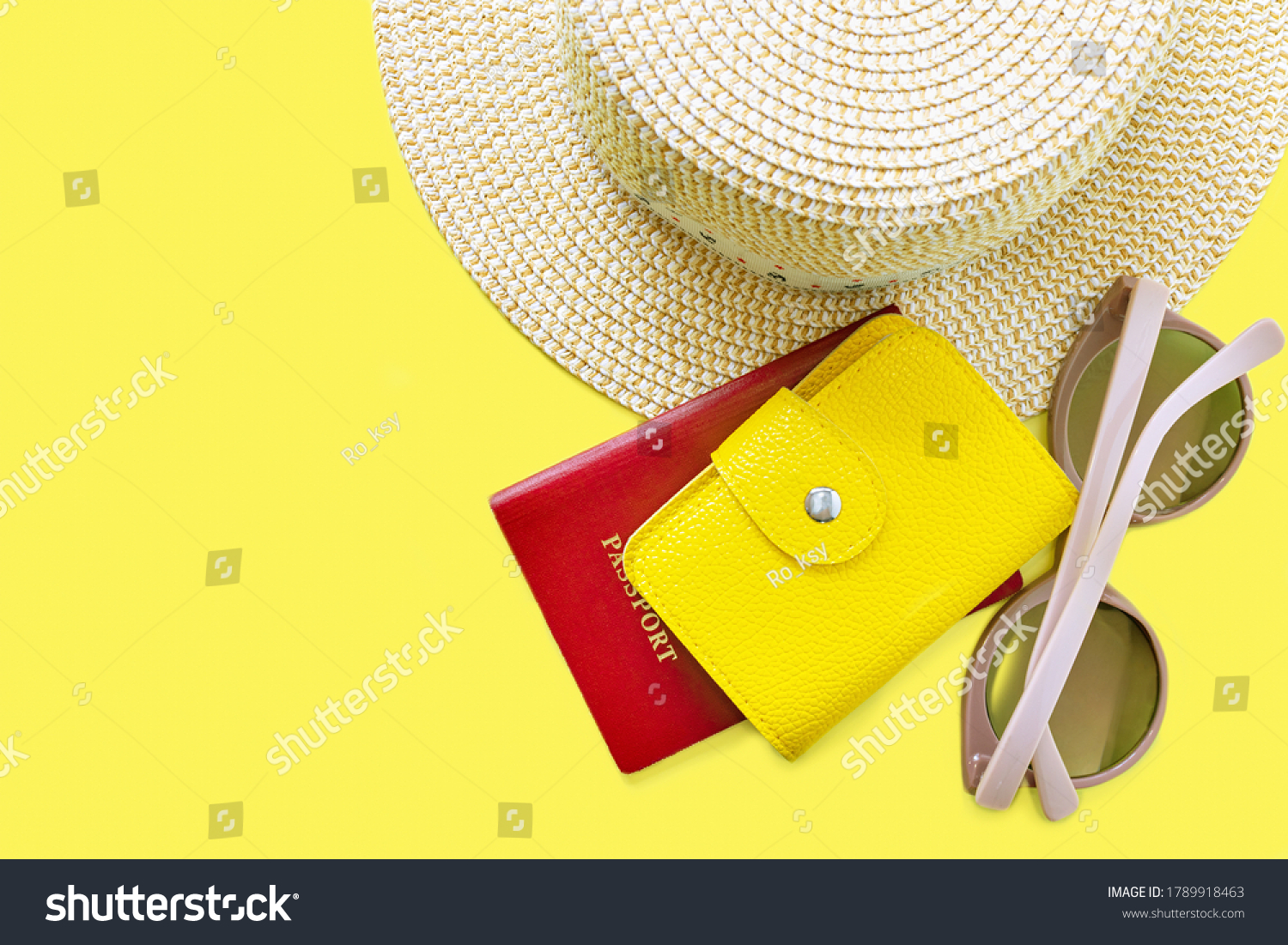 Top view of hat, sunglasses and pasport with leather purse. Summer vacation background. Summertime, travel, beach, relax, tourism concept. Yellow background with copy space. #1789918463