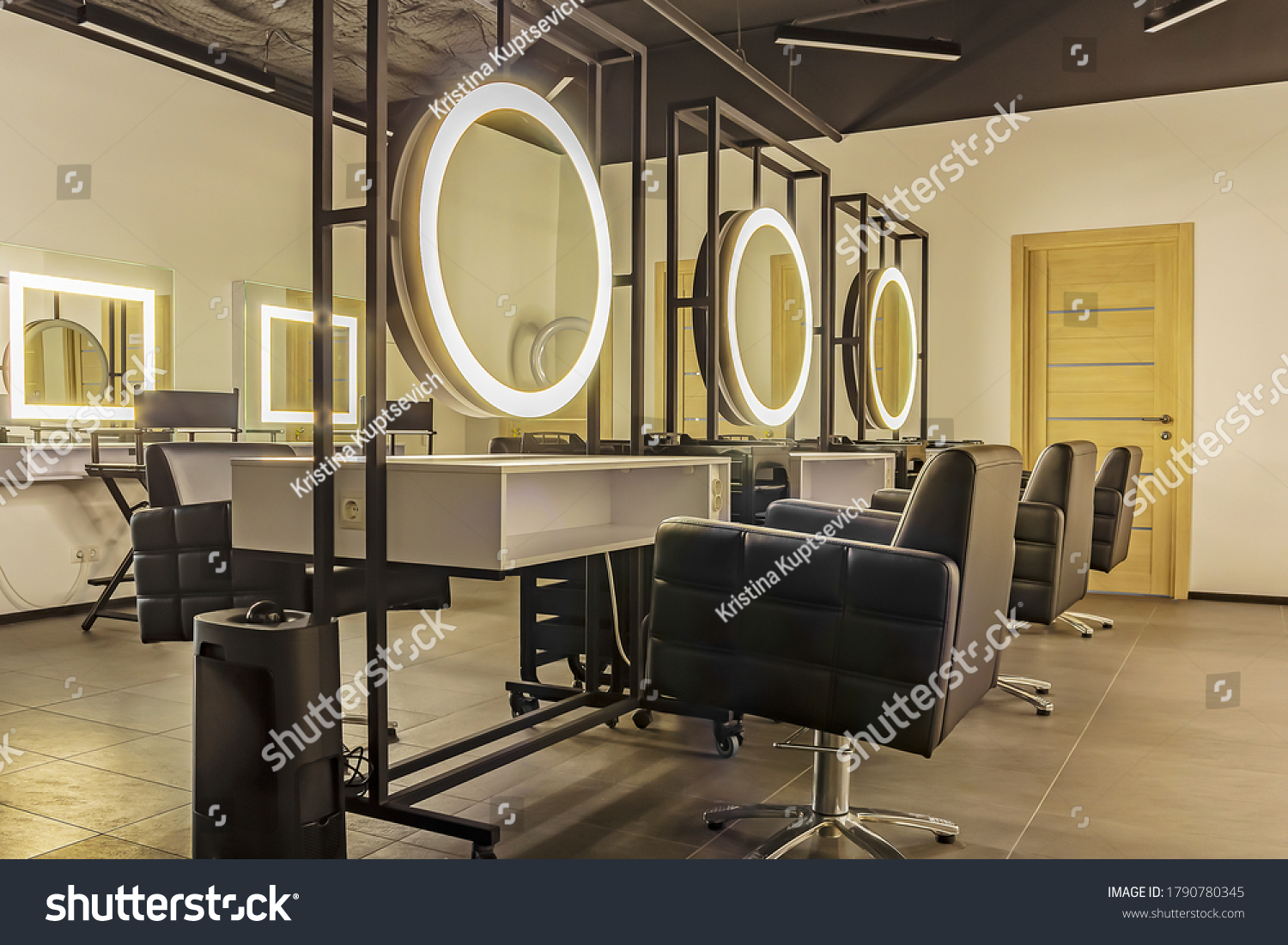 Premium coworking center for hair masters: workplace of the hairdresser with illuminated mirrors and comfortable chairs. Concept of contemporary interior design for hairdresser. Horizontal orientation #1790780345