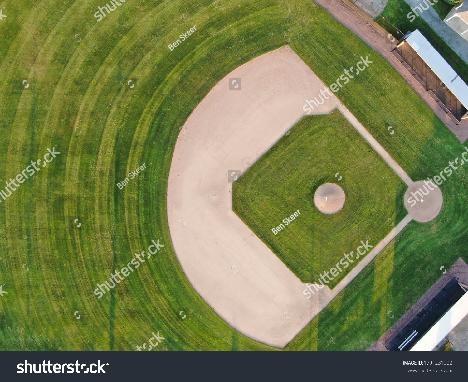 Baseball diamond in pristine condition during the day  #1791231902