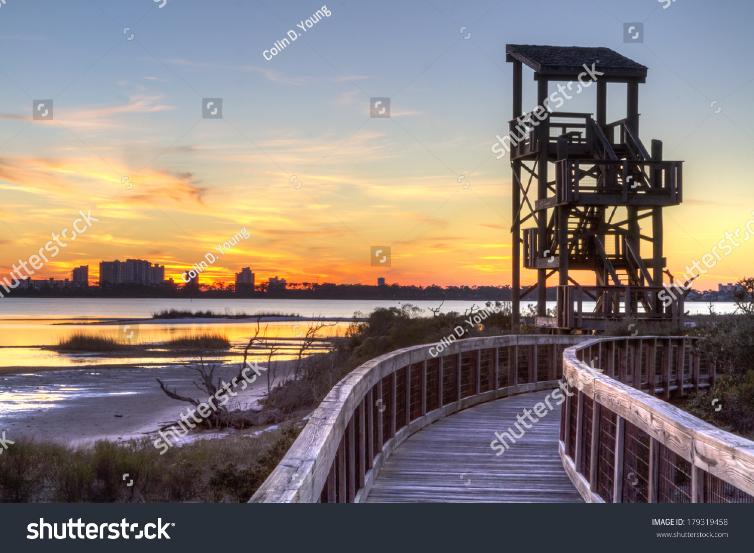 A wildlife observation tower silhouetted against - Royalty Free Stock ...