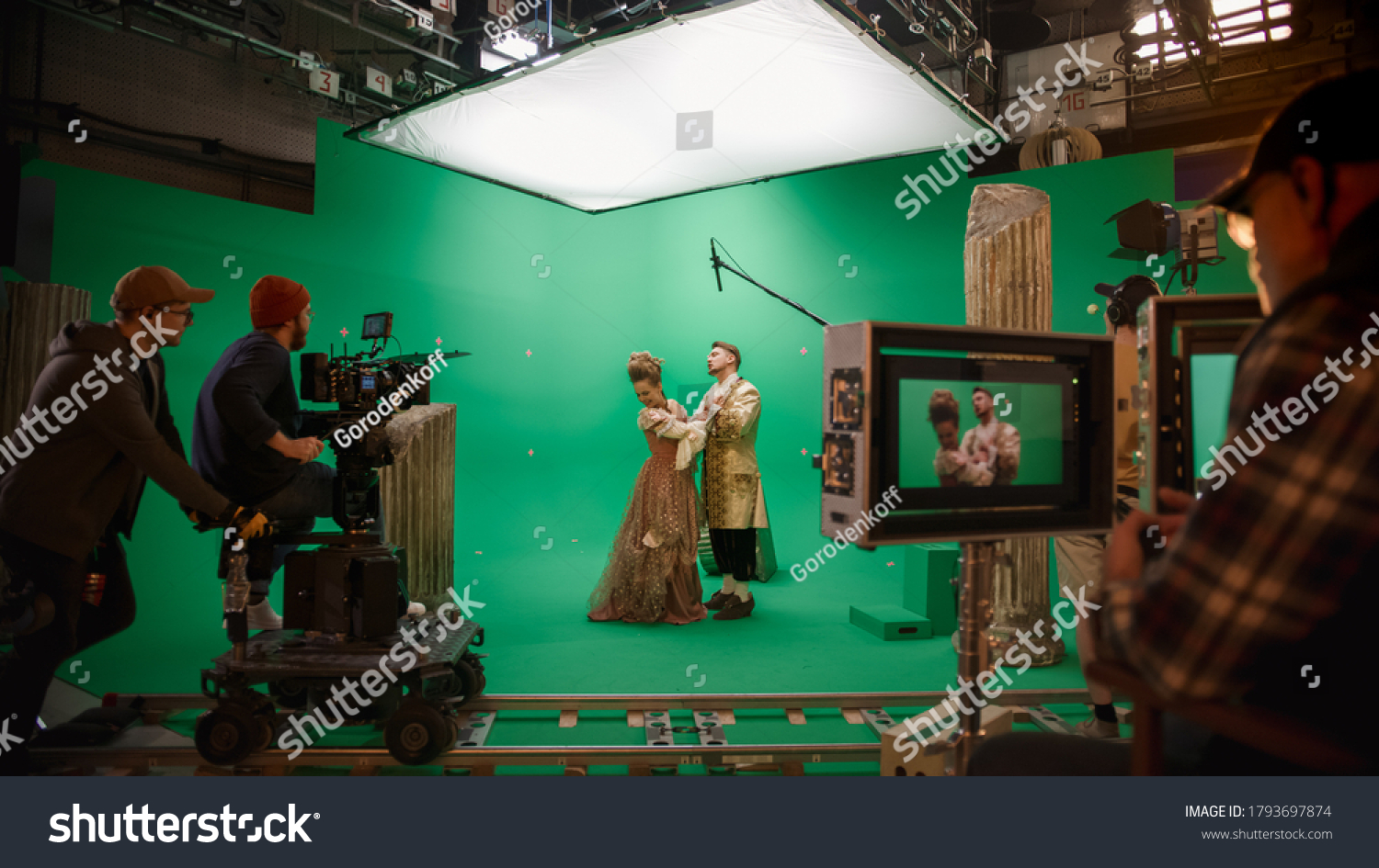 On Big Film Studio Professional Crew Shooting Period Costume Drama Movie. On Set: Director Controls Cameraman Shooting Green Screen Scene with Two Actors Talented Wearing Renaissance Clothes Talking #1793697874
